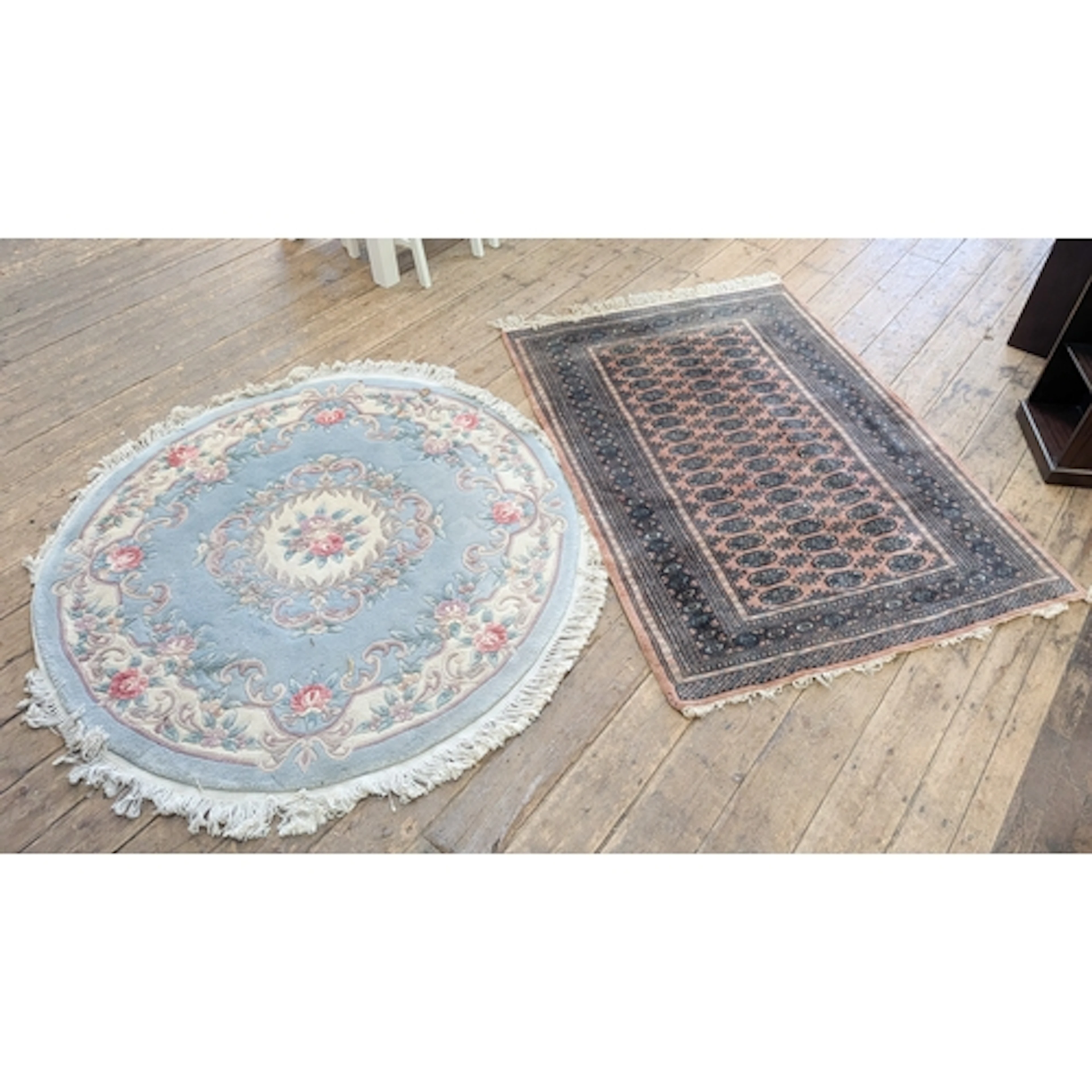 A large circular pale blue and floral embossed Chinese rug t...