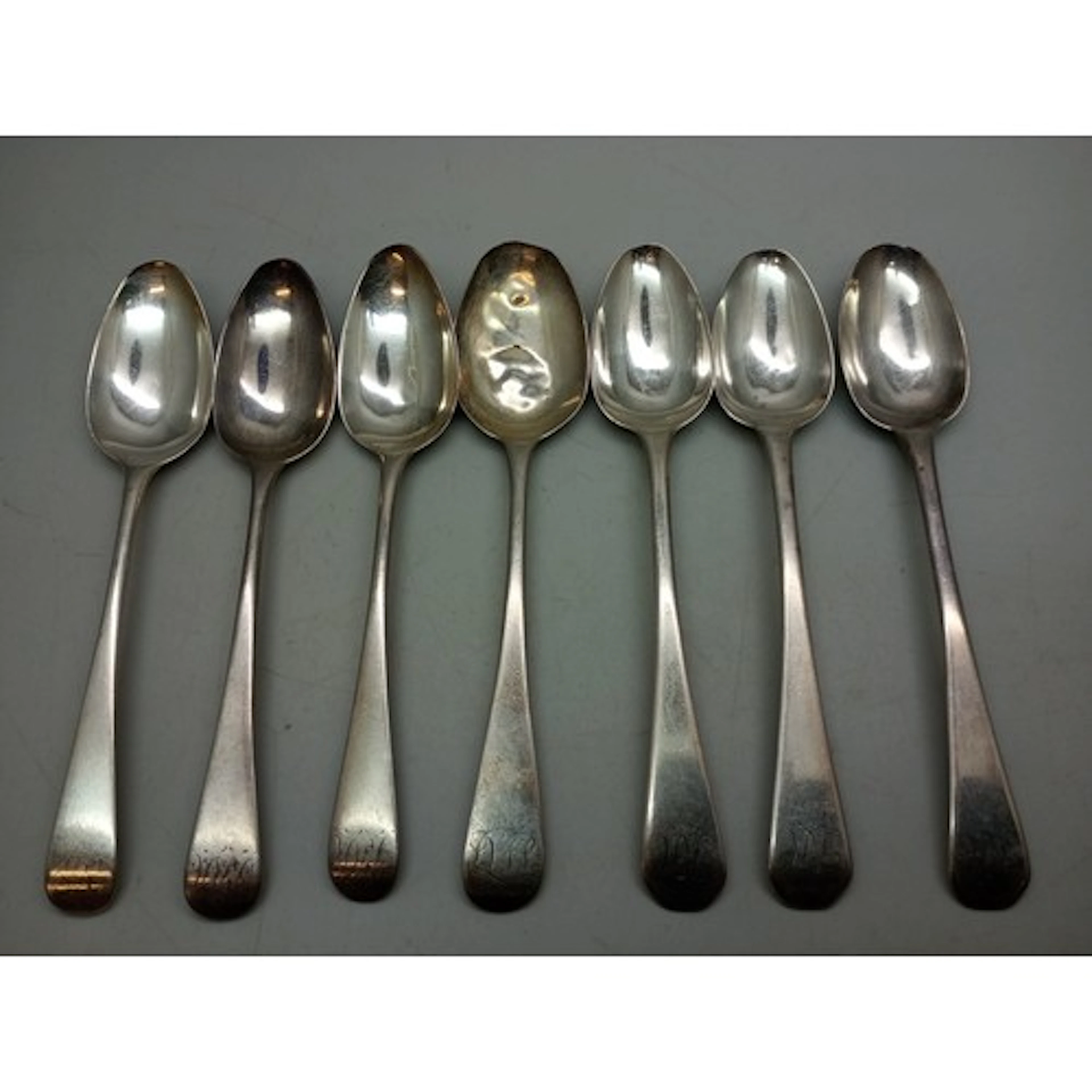 A collection of Georgian silver teaspoons, two matched sets ...