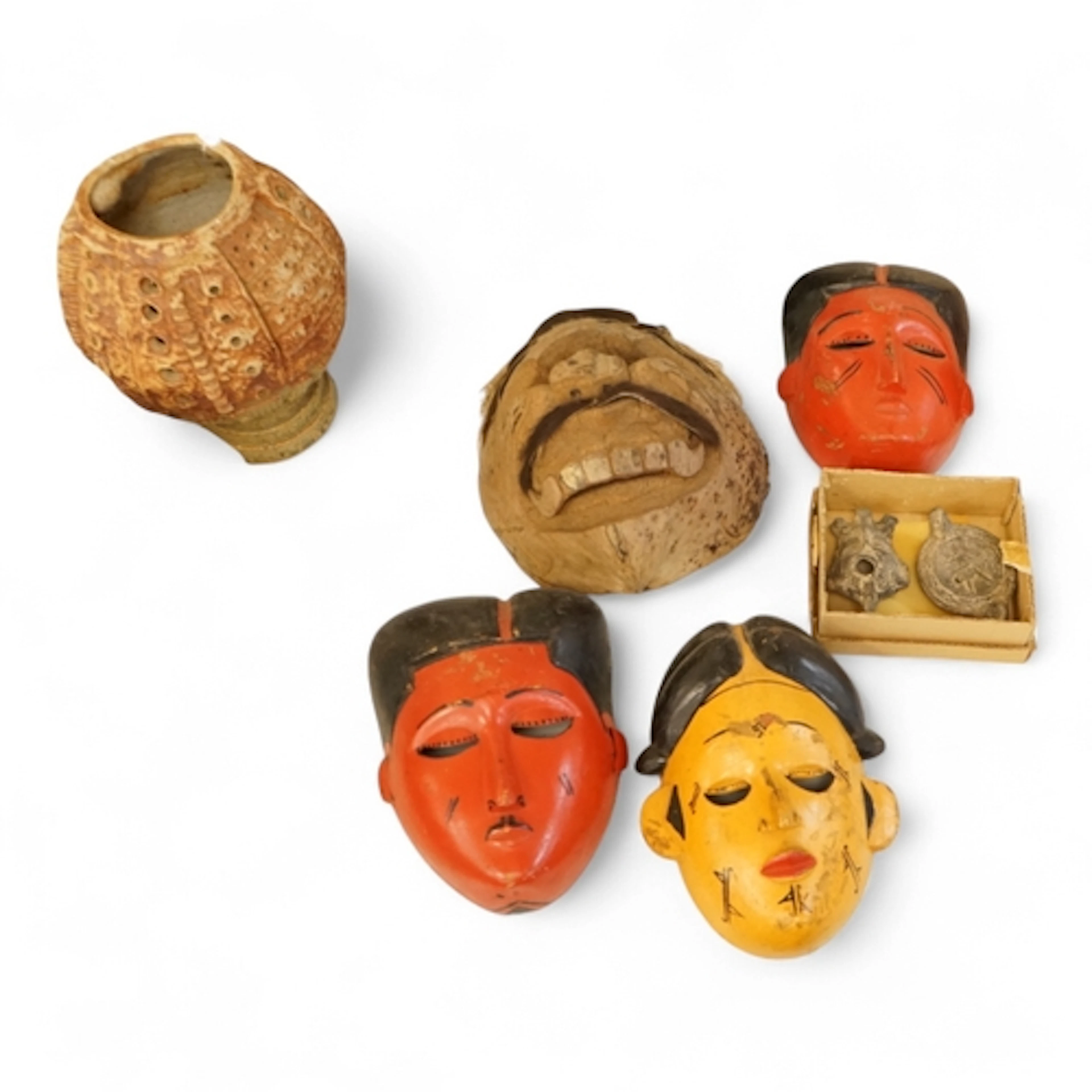 Four Japanese masks, two small oil lamps and a framed batik-...