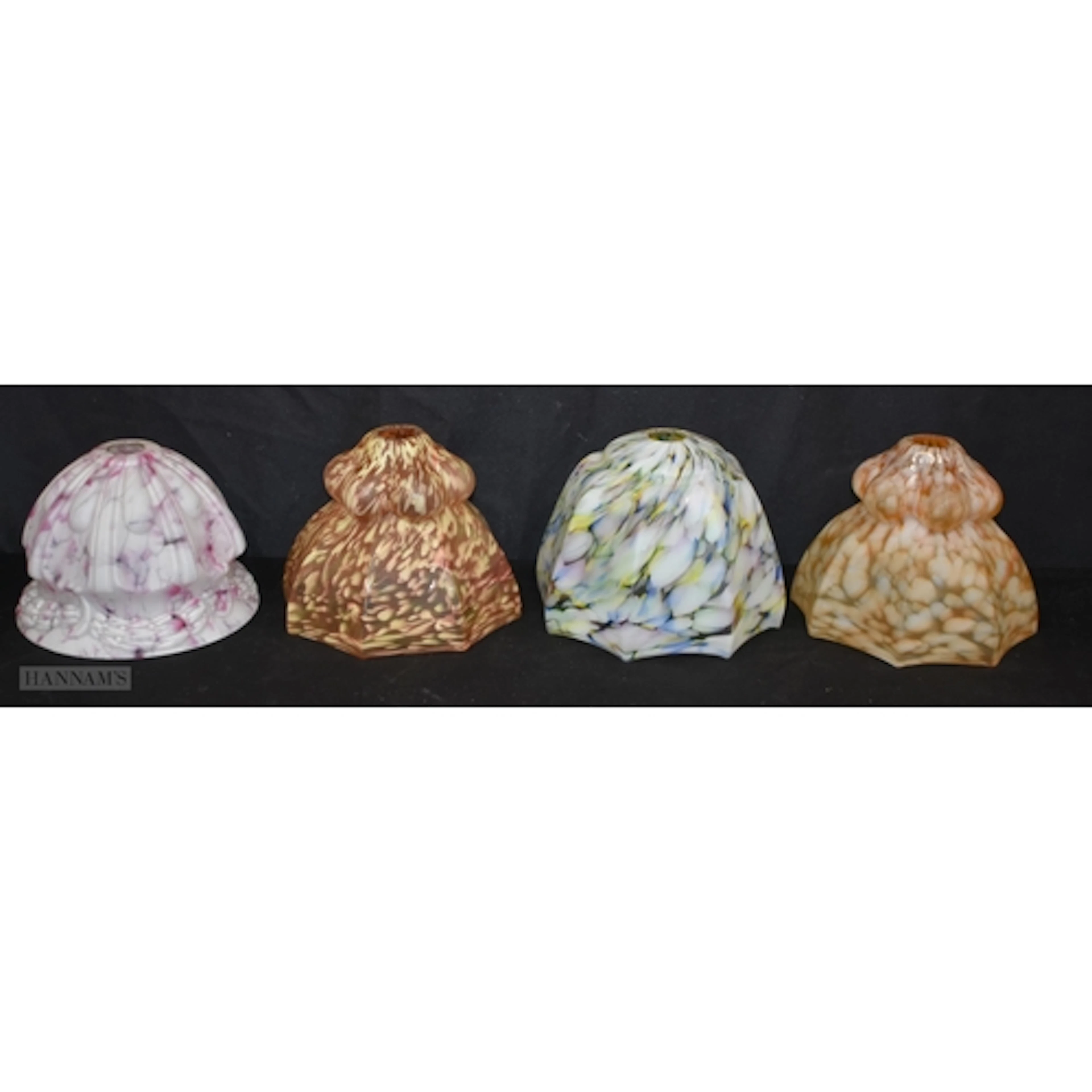 A collection of vintage Art Deco style marbled glass lamp sh...