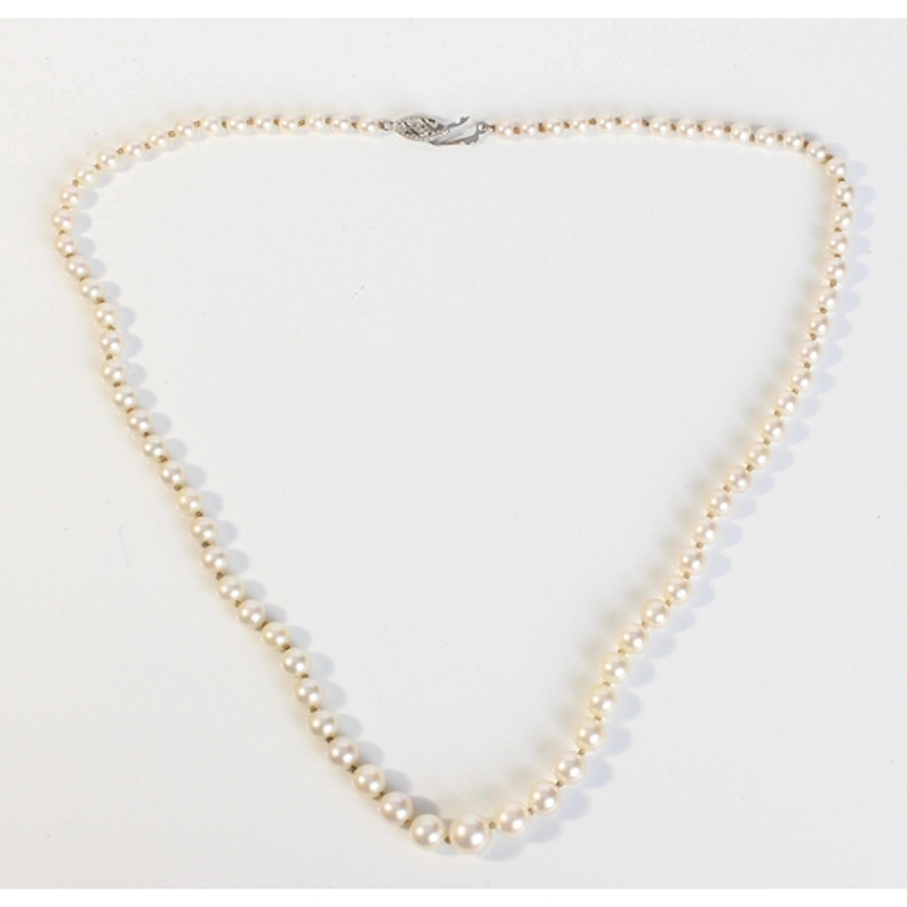A single-strand graduated cultured pearl necklace - the pear...