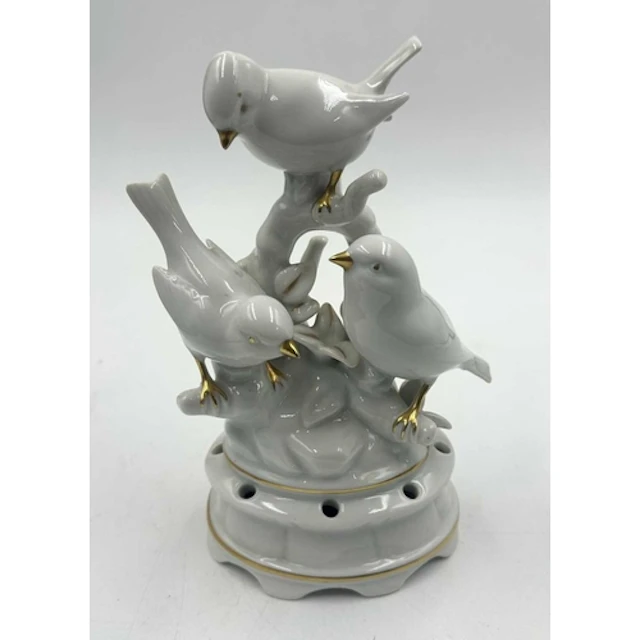 A Gerold and Co Bavaria porcelain figuine with gold accents ...