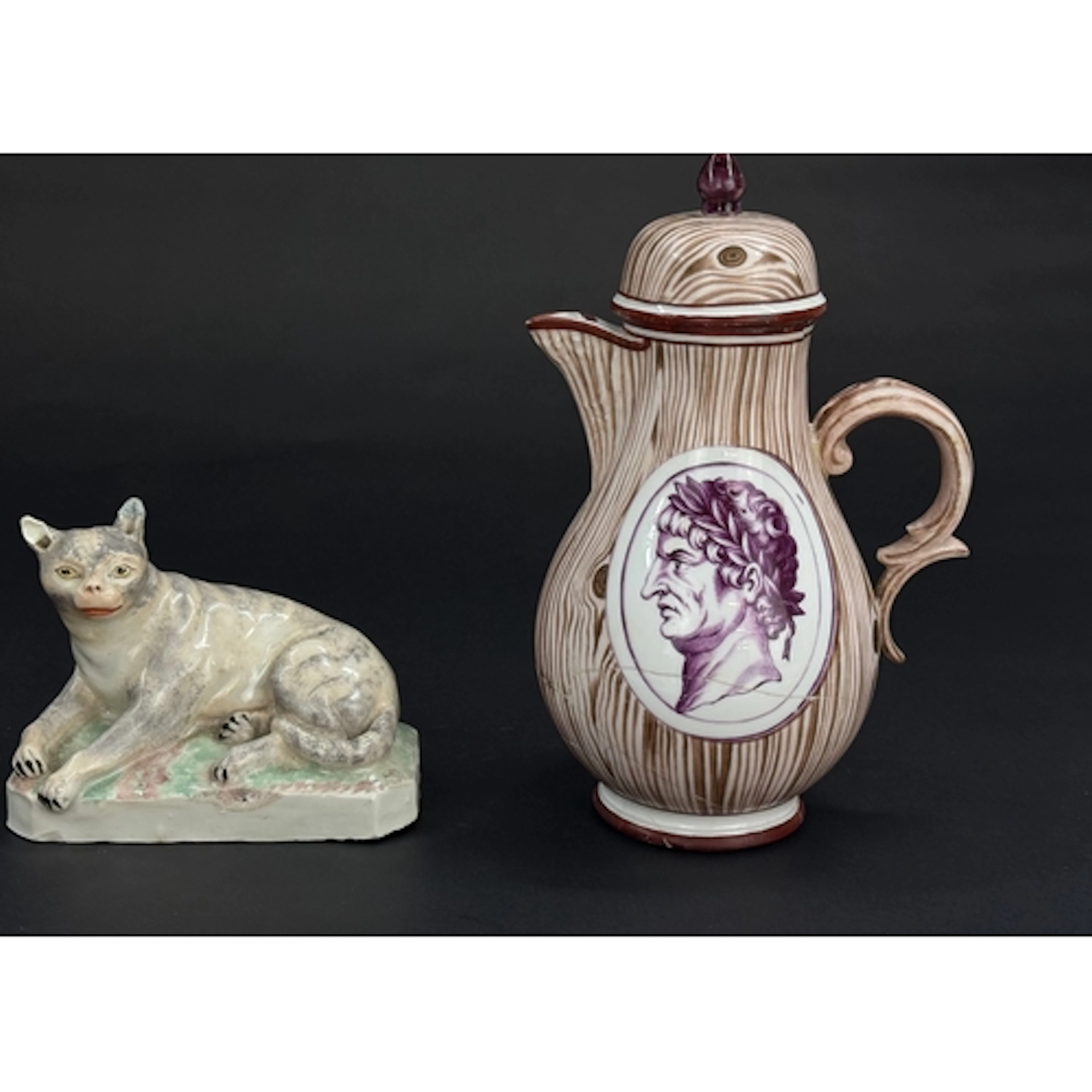 A Ludwigsburg figure of a cat, c.1770, recumbent on a chamfe...