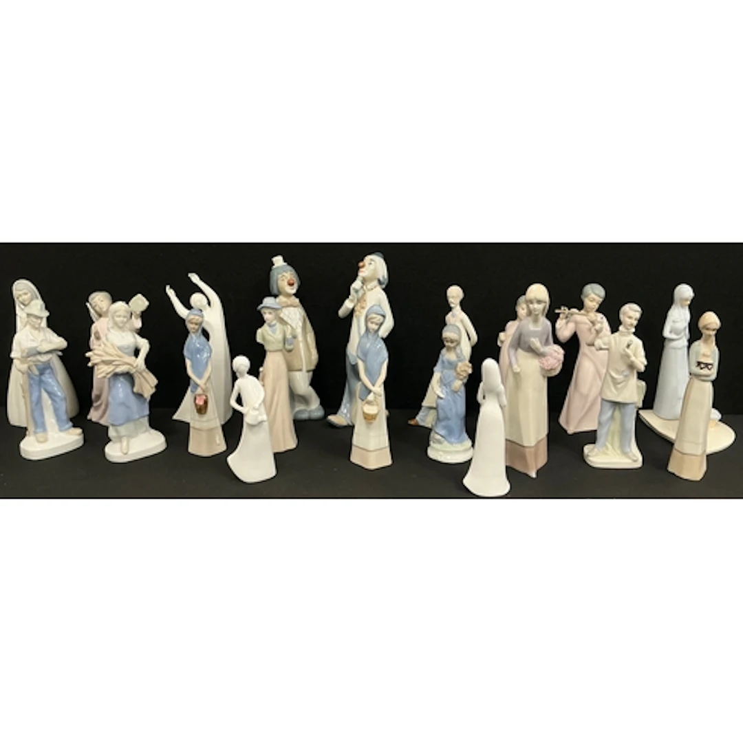 Miquel Ceramic figurines, a winged pair playing flute and vi...