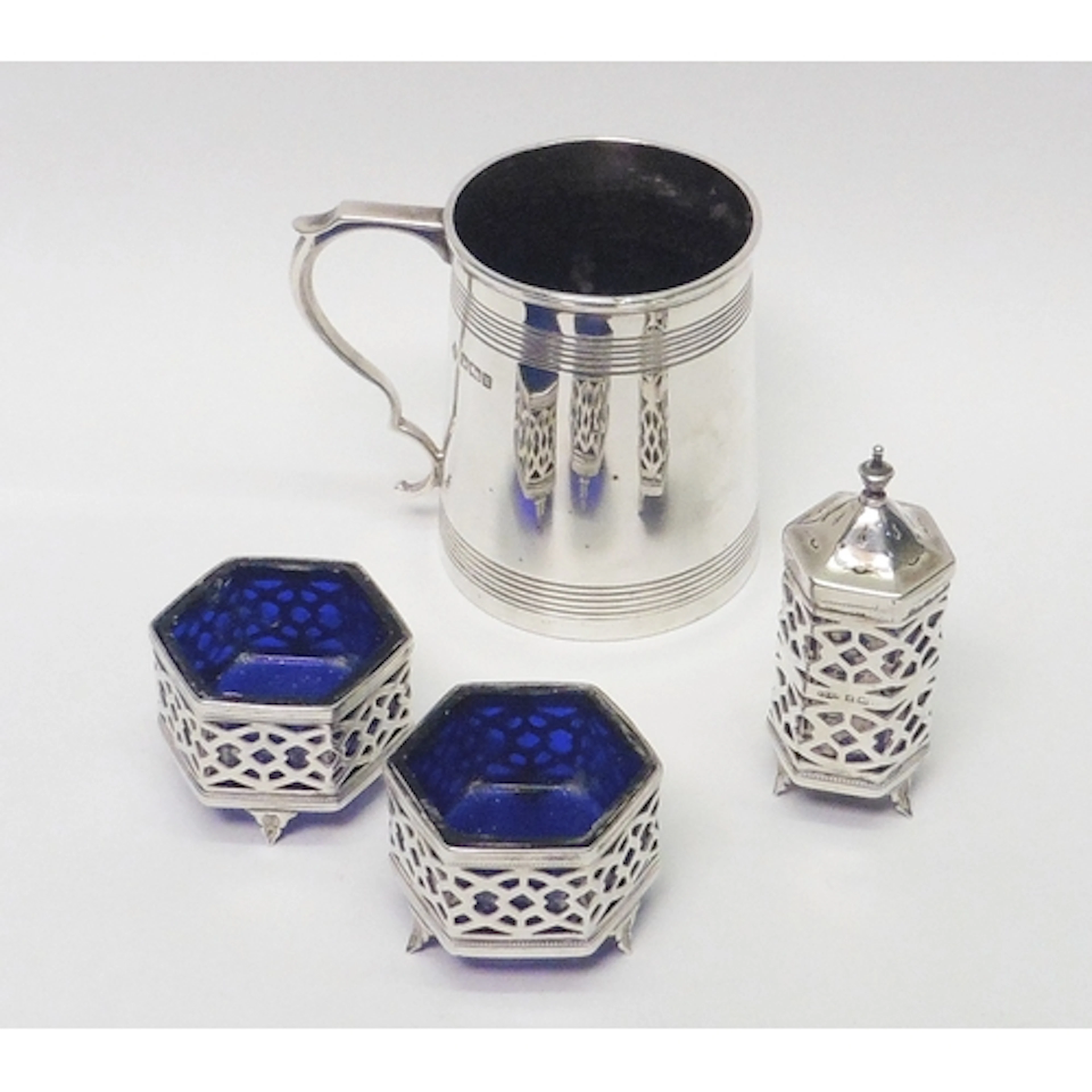 A silver christening mug, early 20th cent, 77mm tall; a pair...