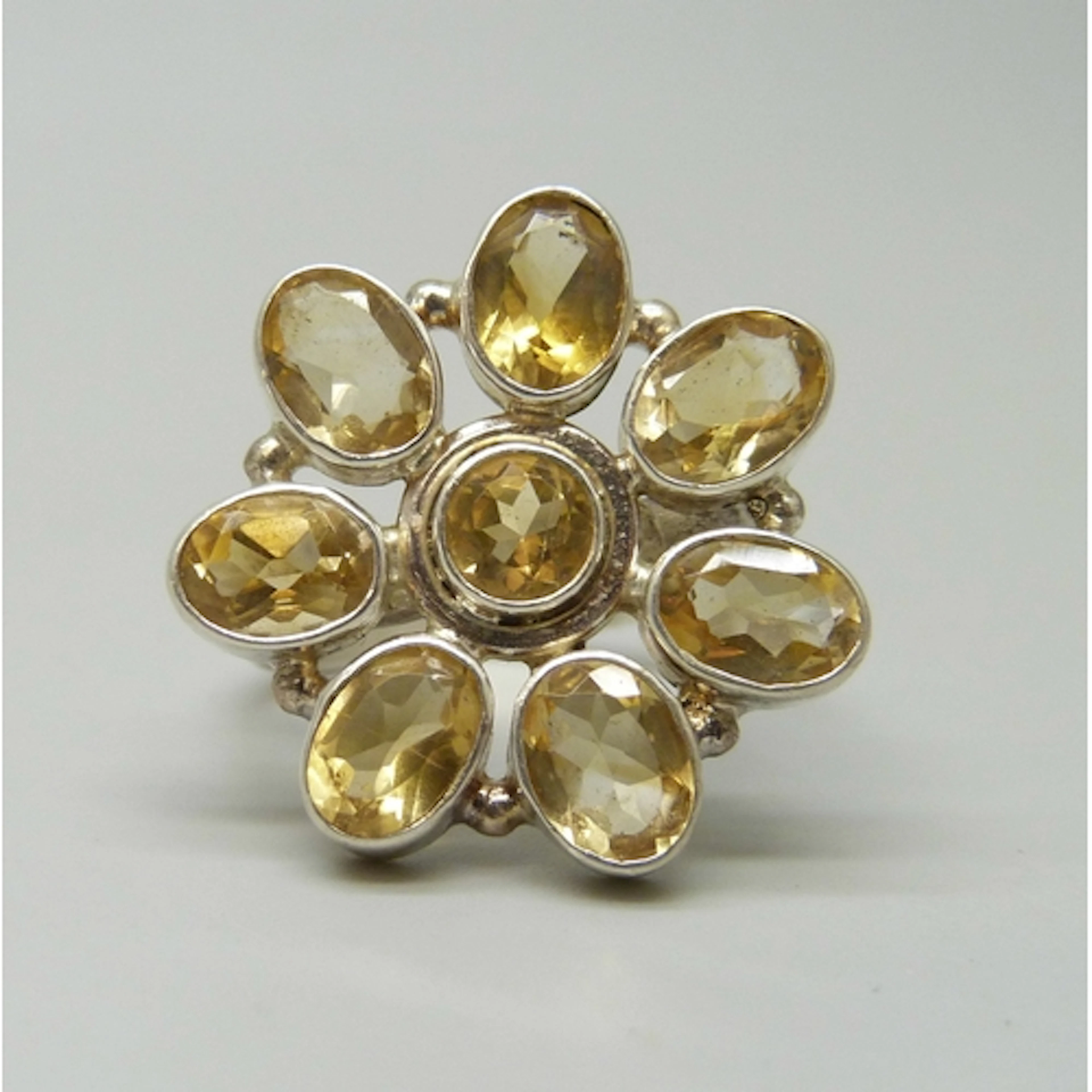 A TGGC statement silver and citrine floral design ring, 2.4c...