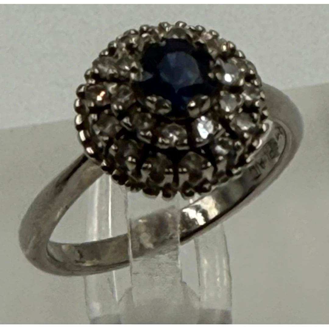 An 18ct gold and platinum diamond and sapphire cluster ring....