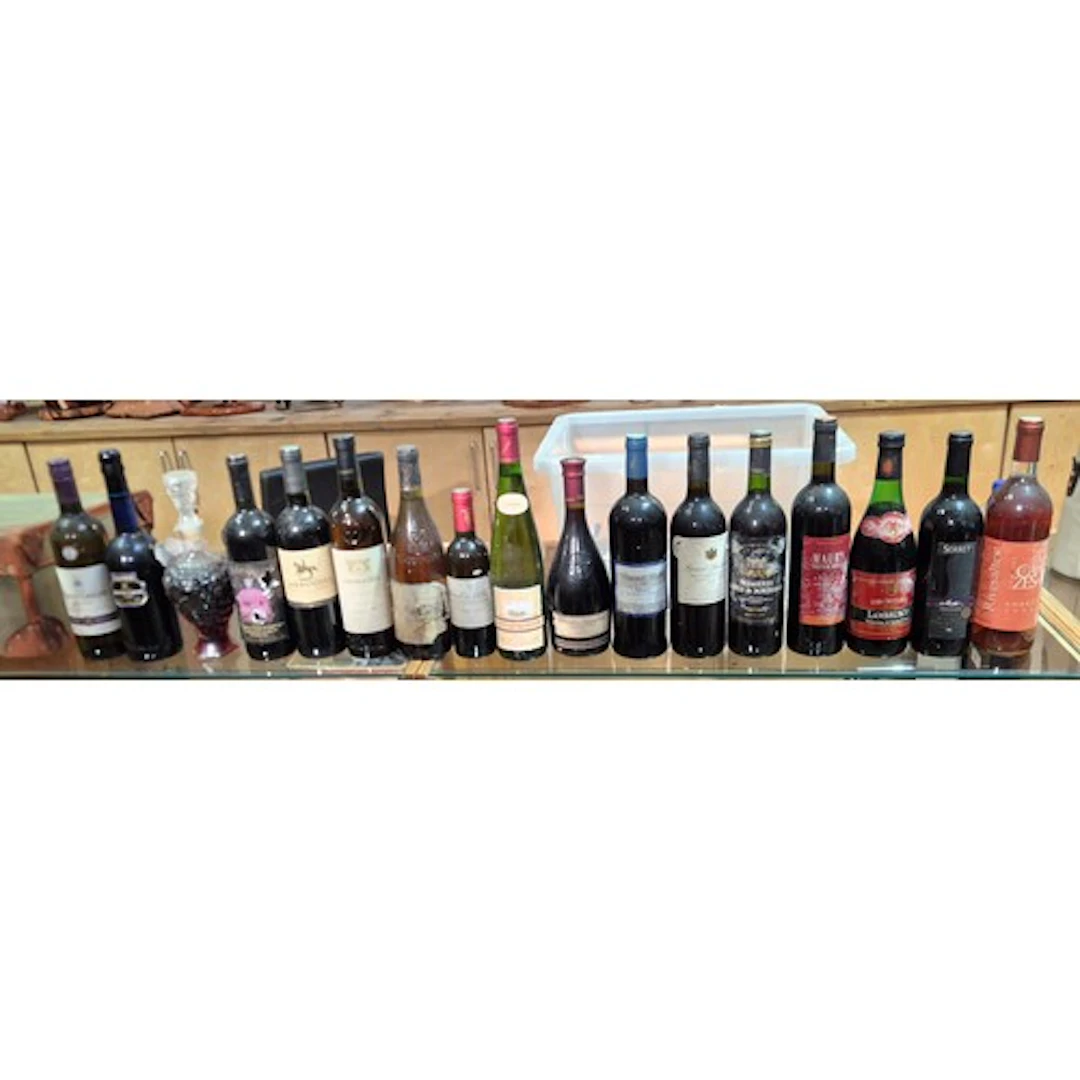 A group of assorted alcohol to include vintage red wines etc...