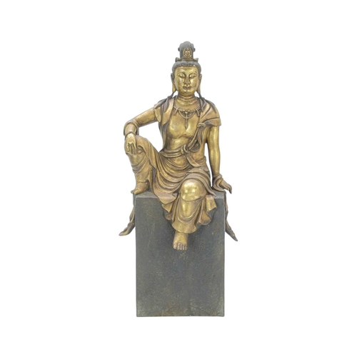 A Chinese bronze and gilded figure of Guanyin. Probably earl...