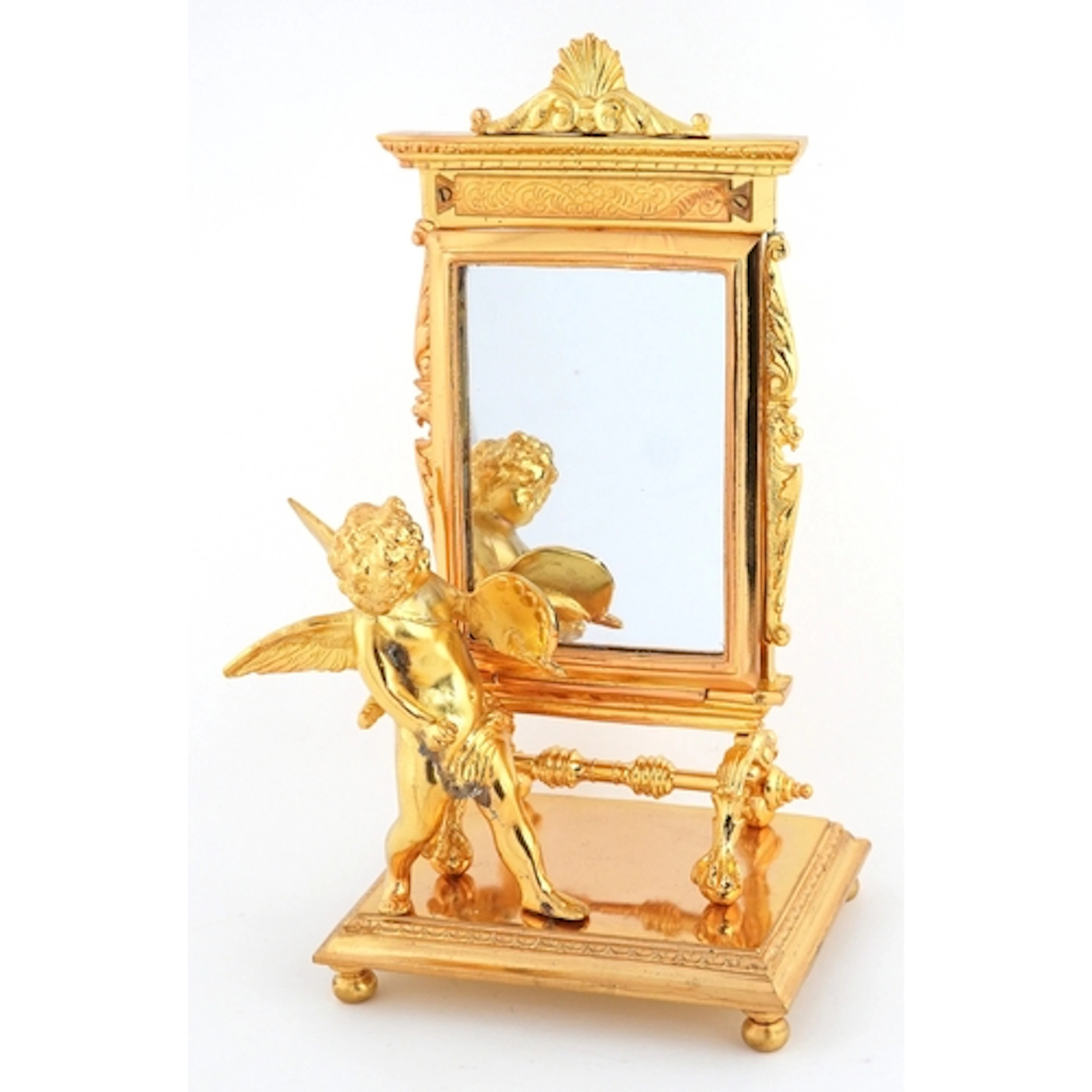 Novelty gilt metal desk mirror mounted with a putto, 23cm hi...