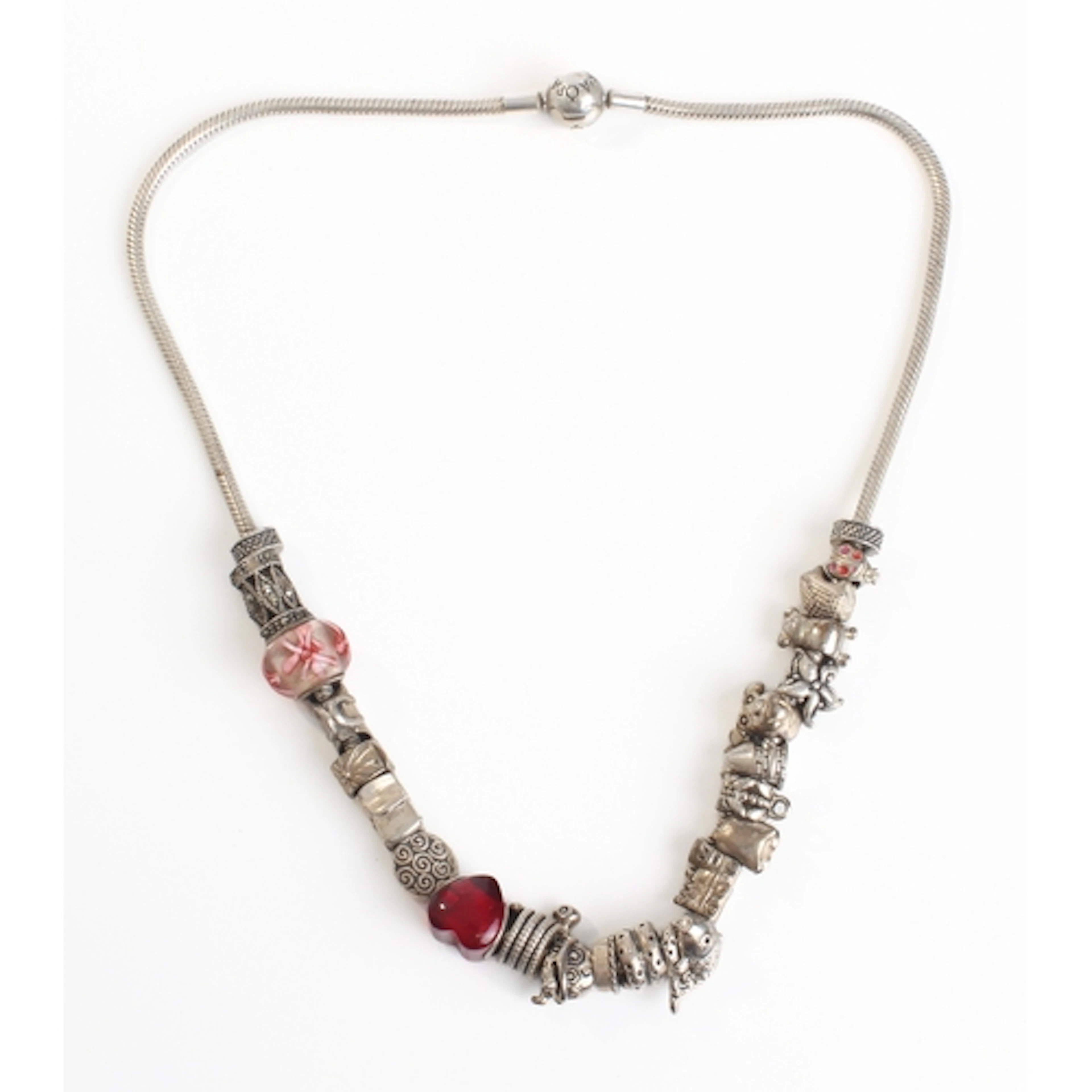 A silver necklace (marked Pandora) with numerous charms.