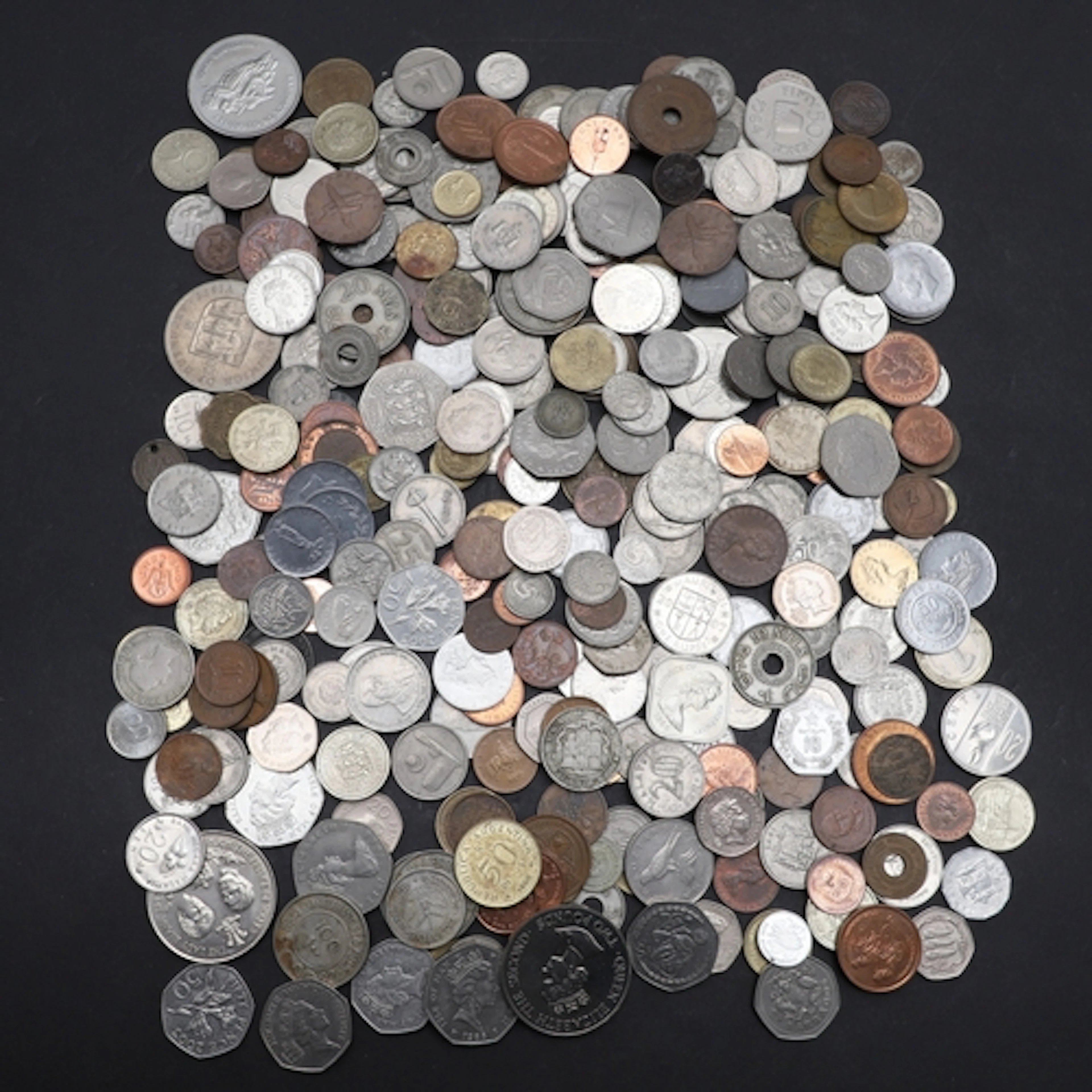 WORLD COINS: A COLLECTION OF COINS FROM DIVERSE COUNTRIES IN...