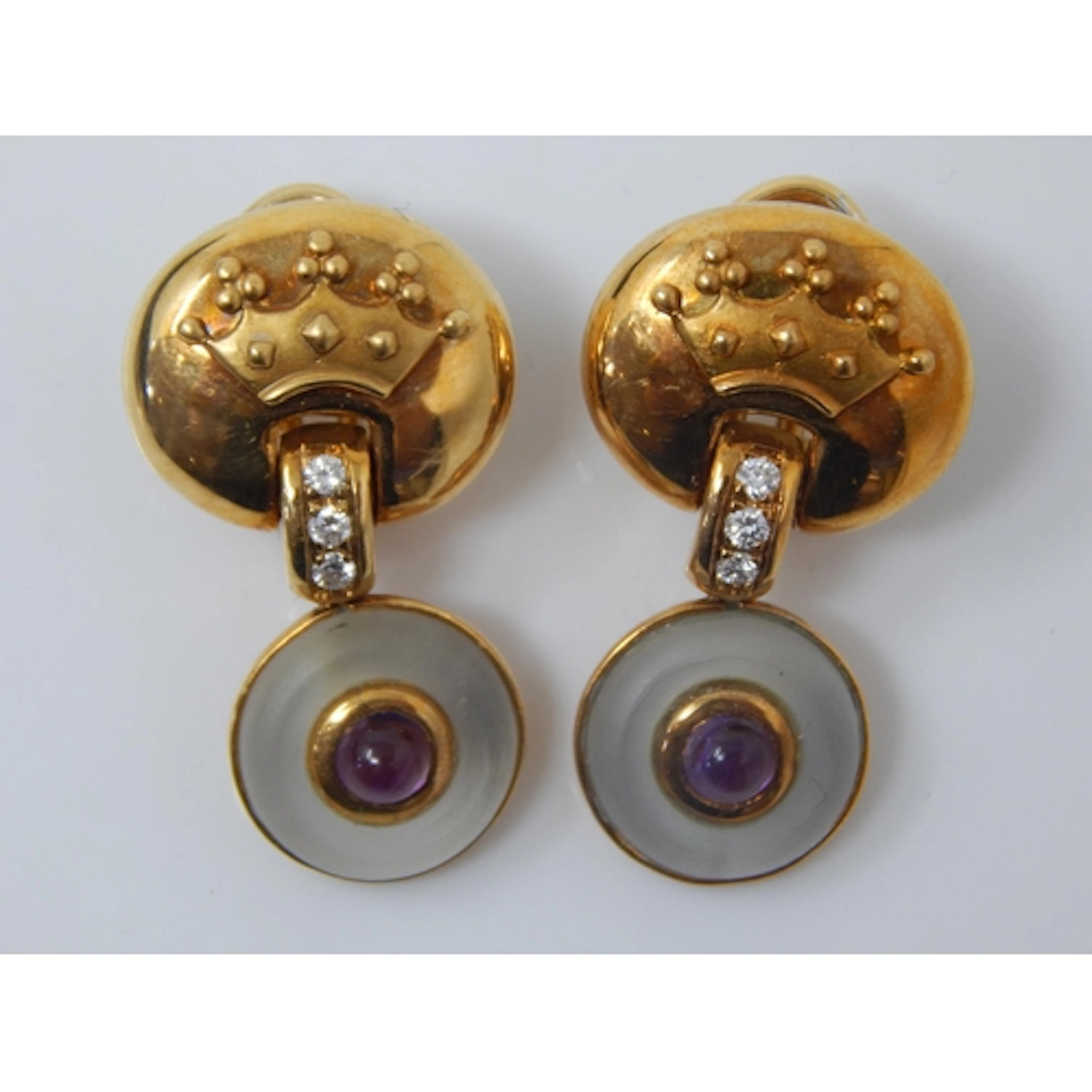 GARRARD: A Pair of 18ct Gold Earrings Each Set with Three Ro...