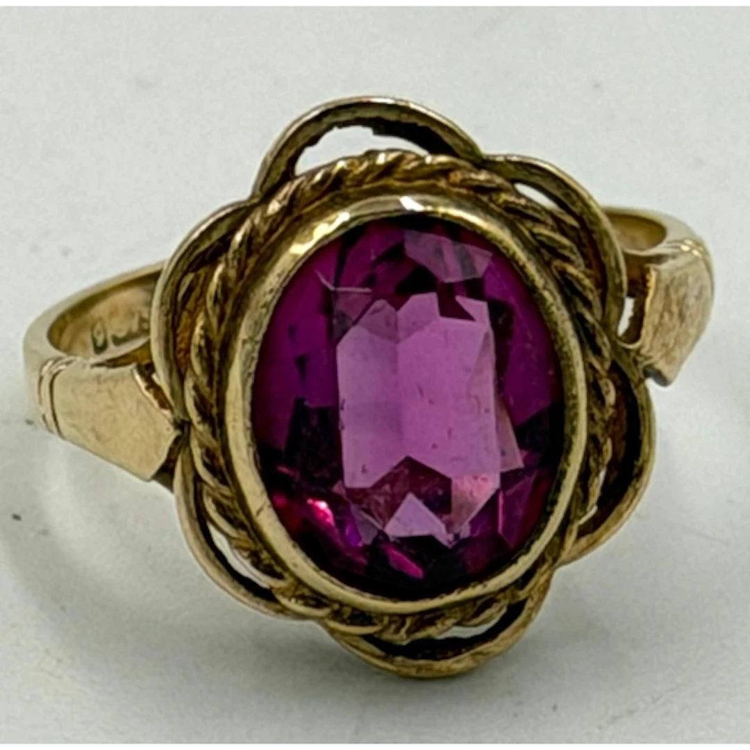 A 9ct yellow gold set pink stone ring, approximate weight 3....