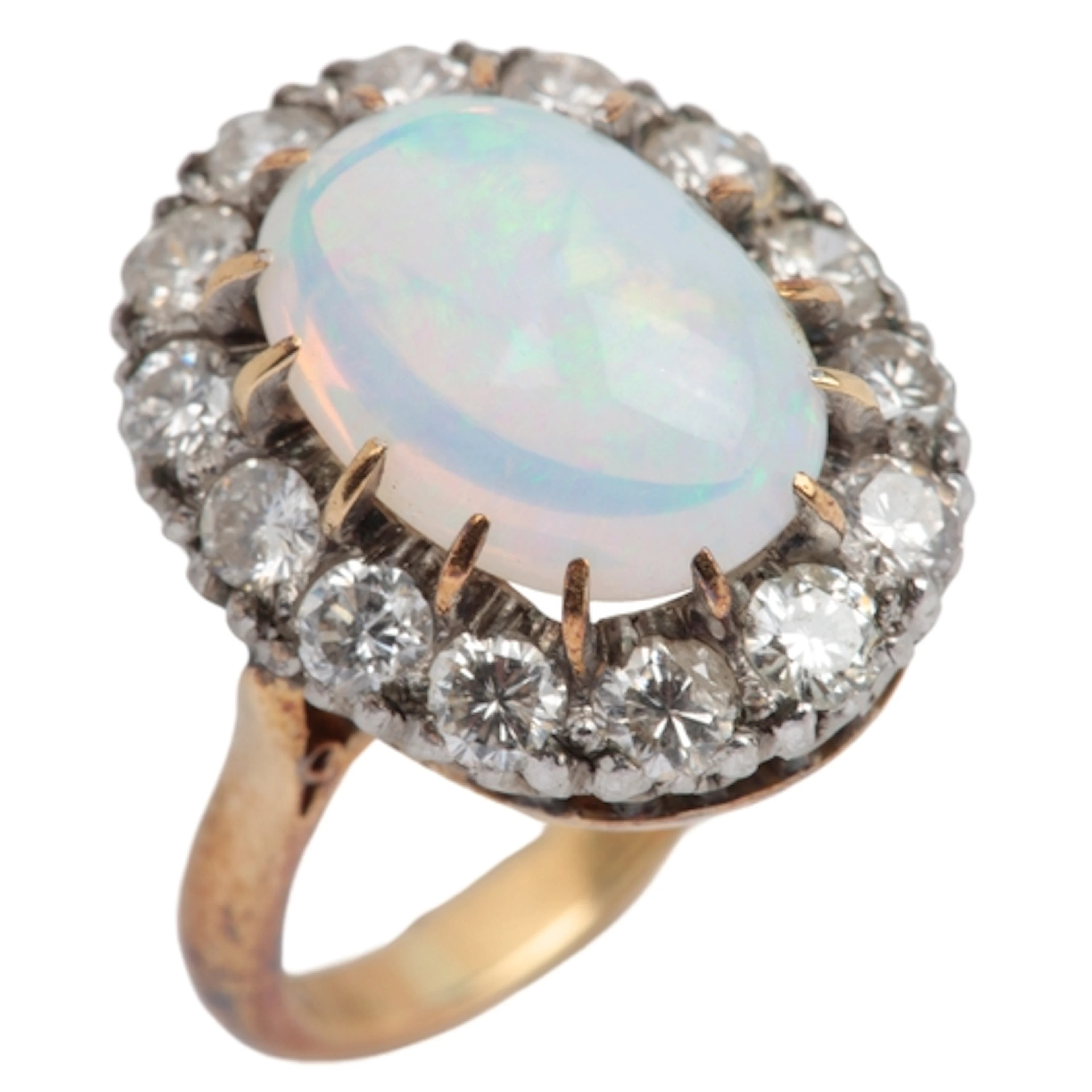 An opal and diamond ring, of cluster design, set with a cabo...