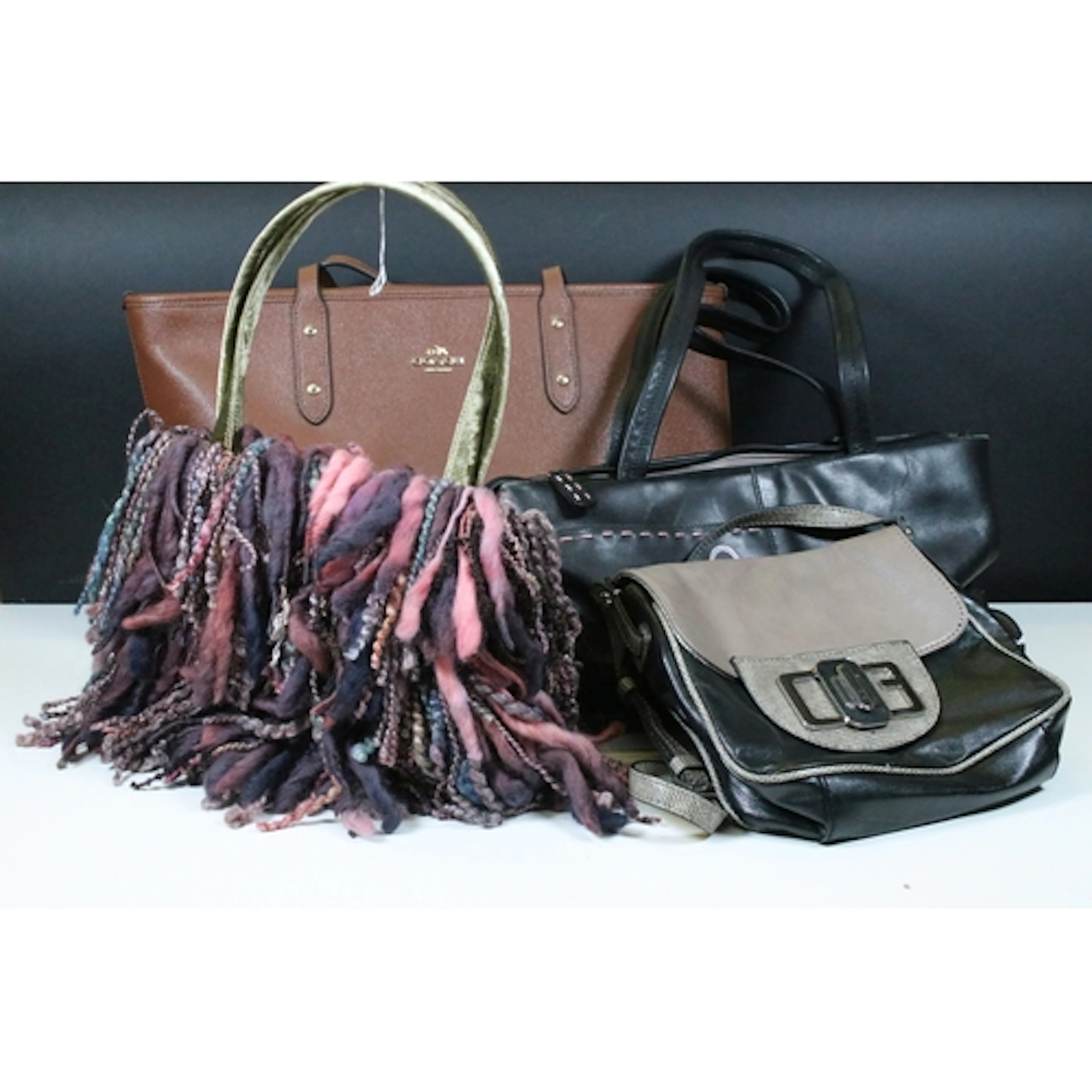Fashion - Coach brown Birkin style bag, having gold tone har...