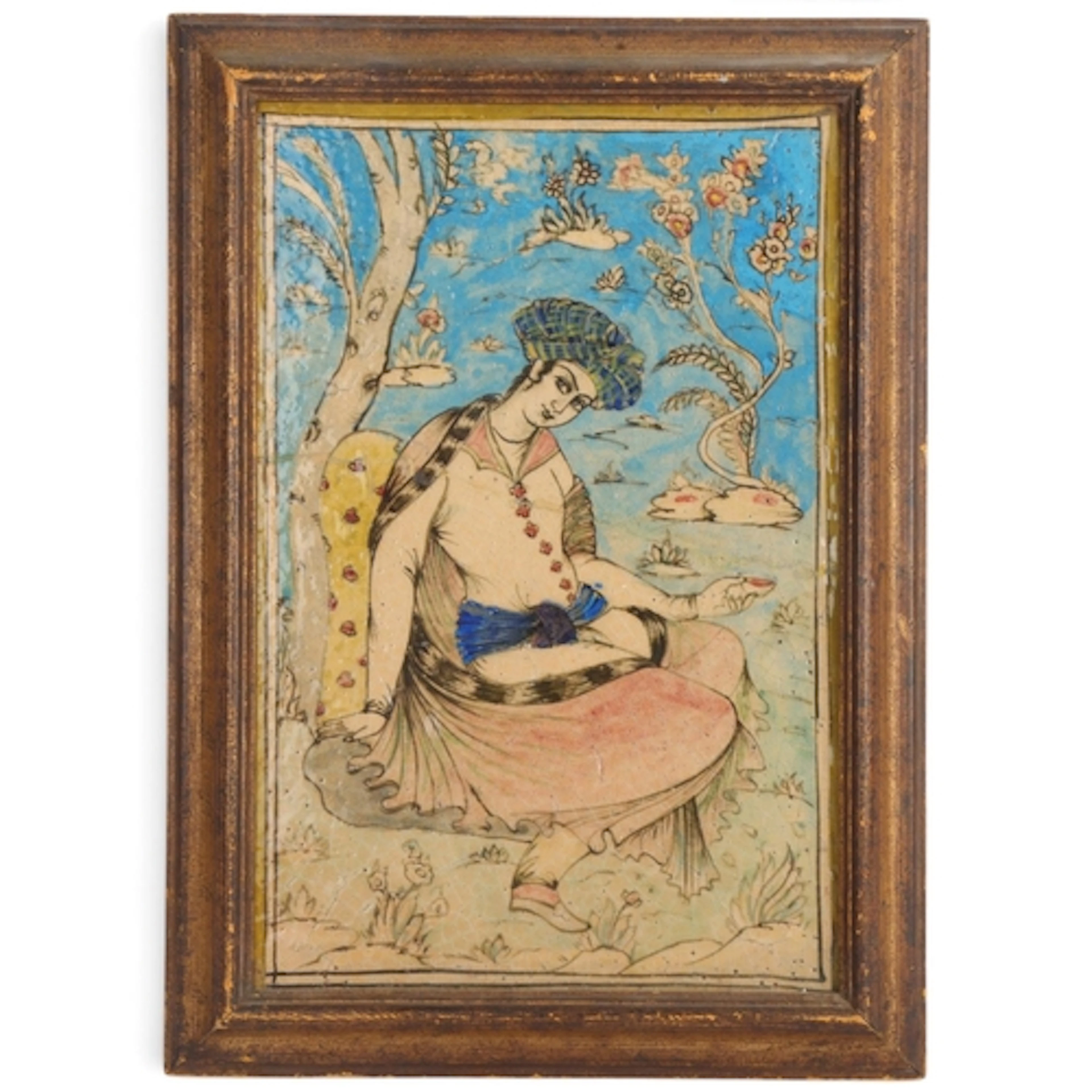 A Persian ceramic tile with painted figure of a noble figure...