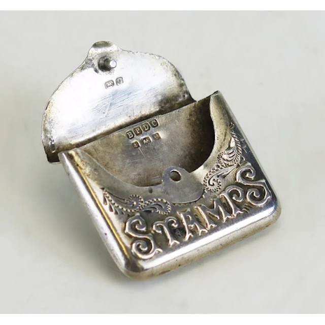 An Edward VII silver stamp holder, maker Boots Pure Drug Com...
