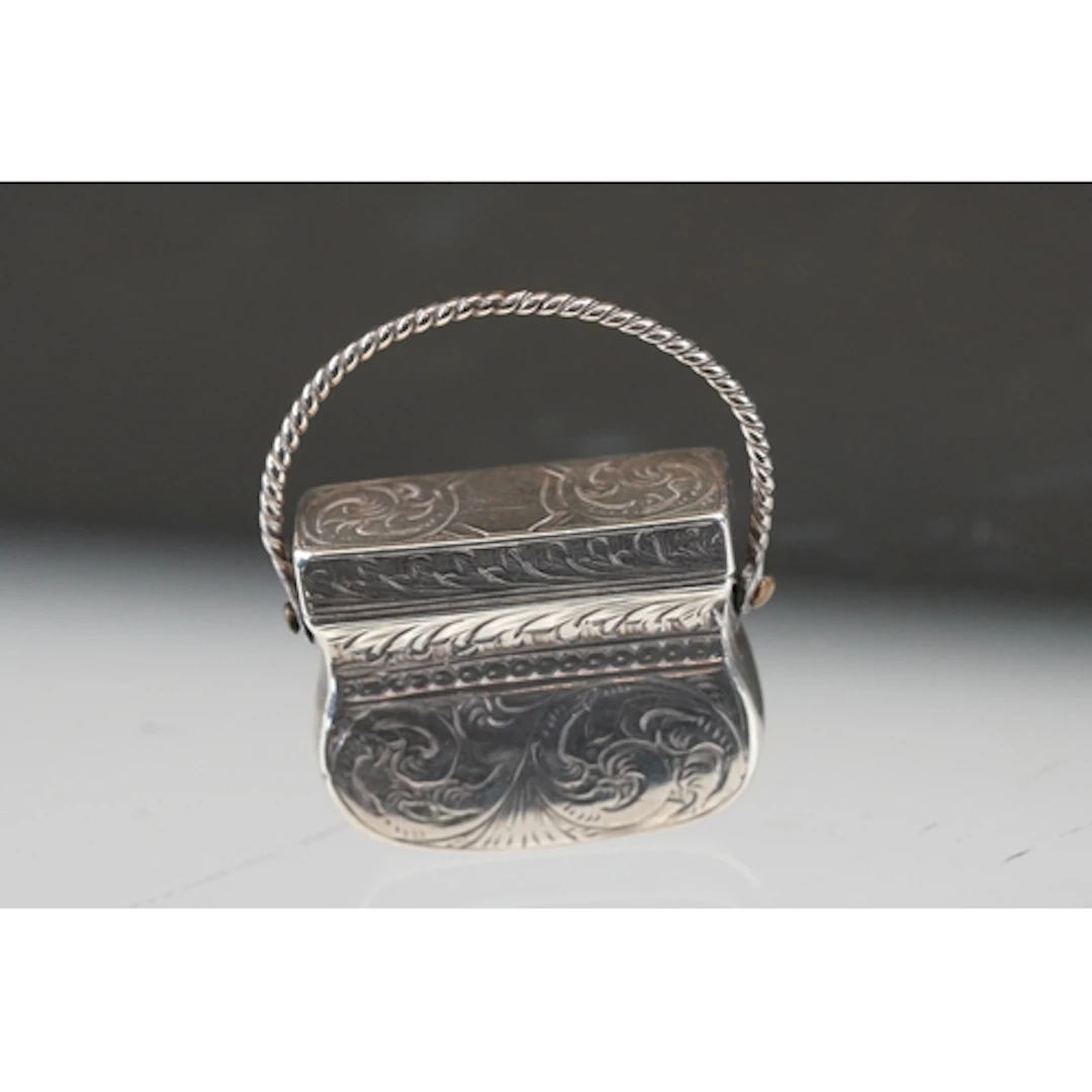 Victorian silver foliate engraved vinaigrette in the form of...