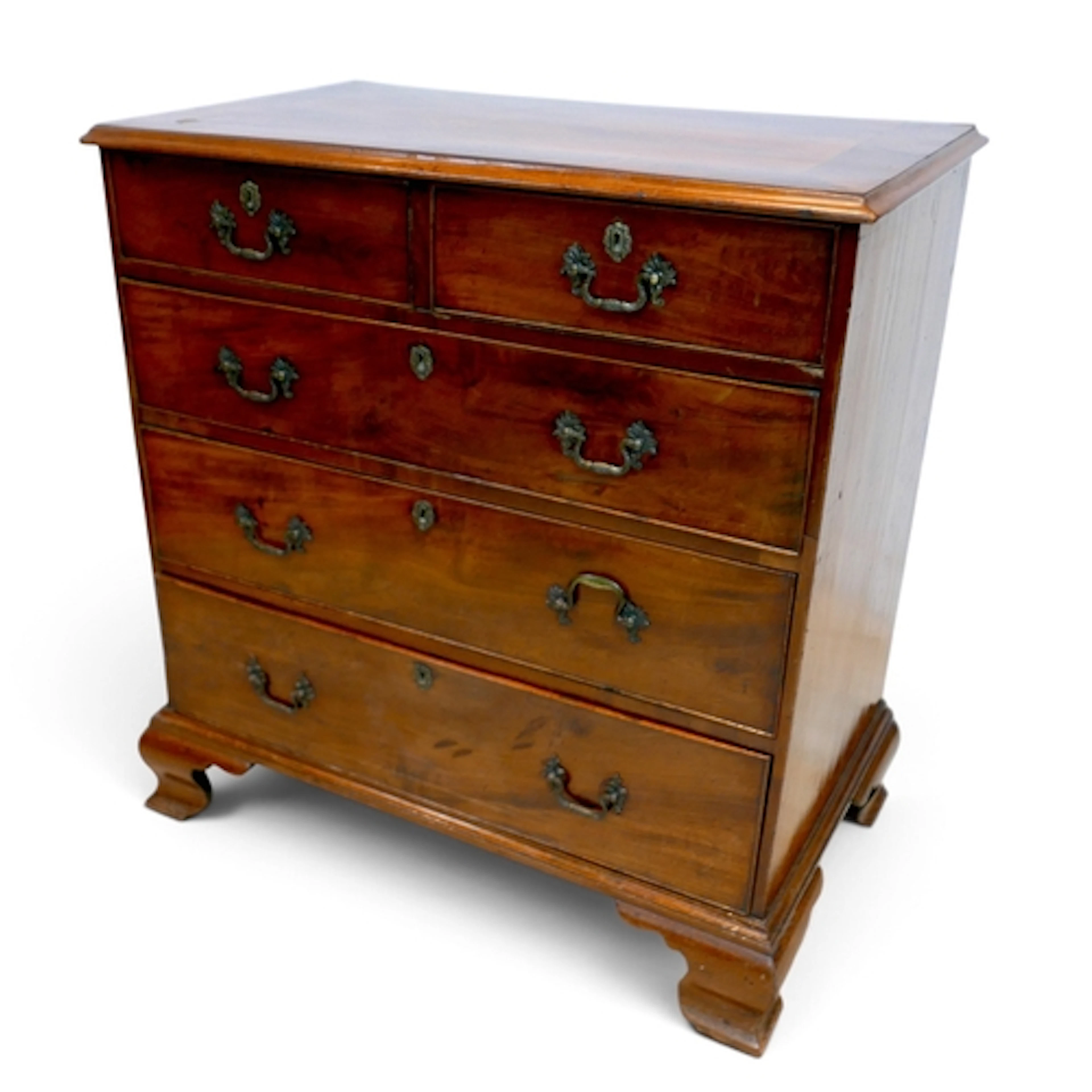 A GEORGE III CHEST. with two short over three long graduatin...