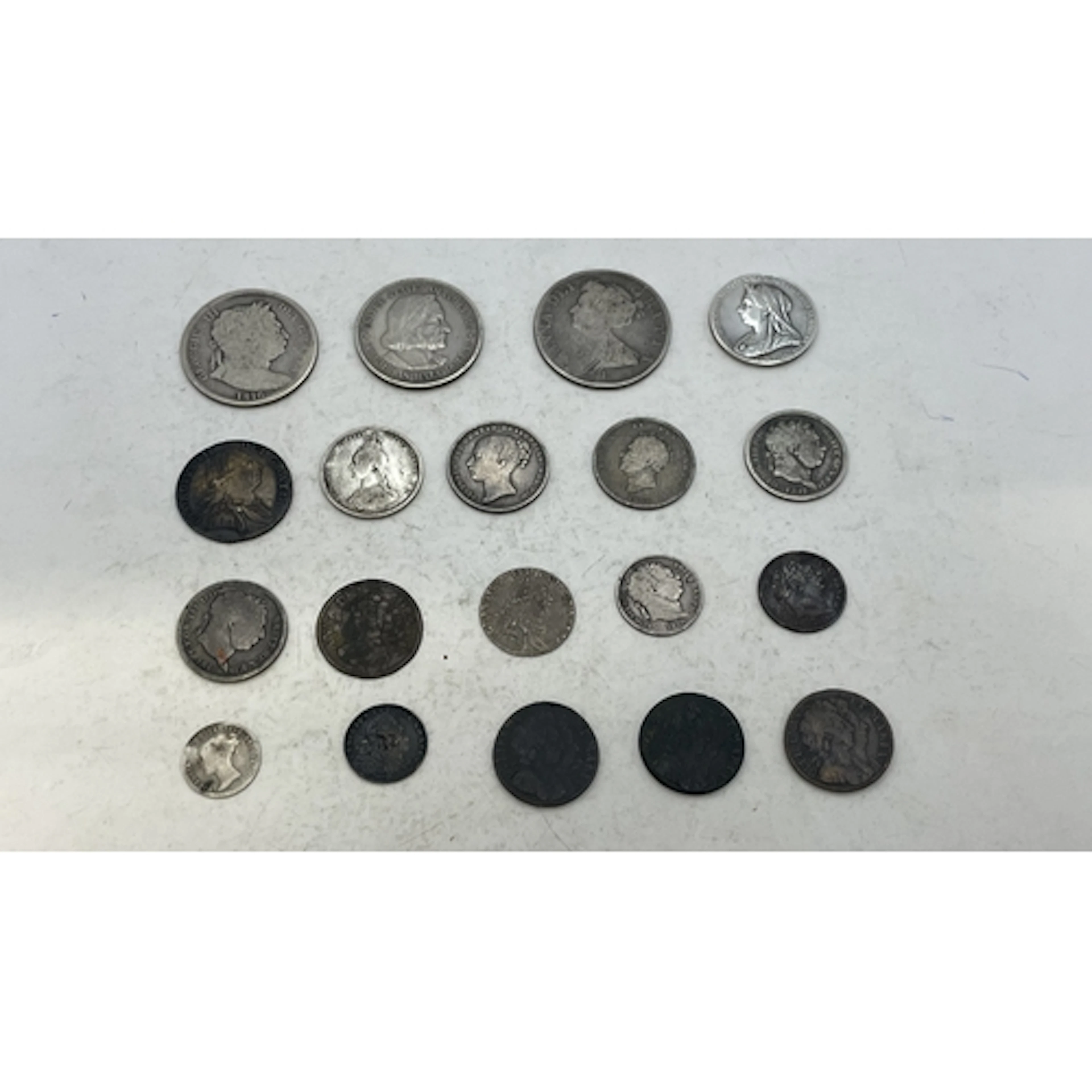 A collection of silver and copper coins to include Queen Ann...