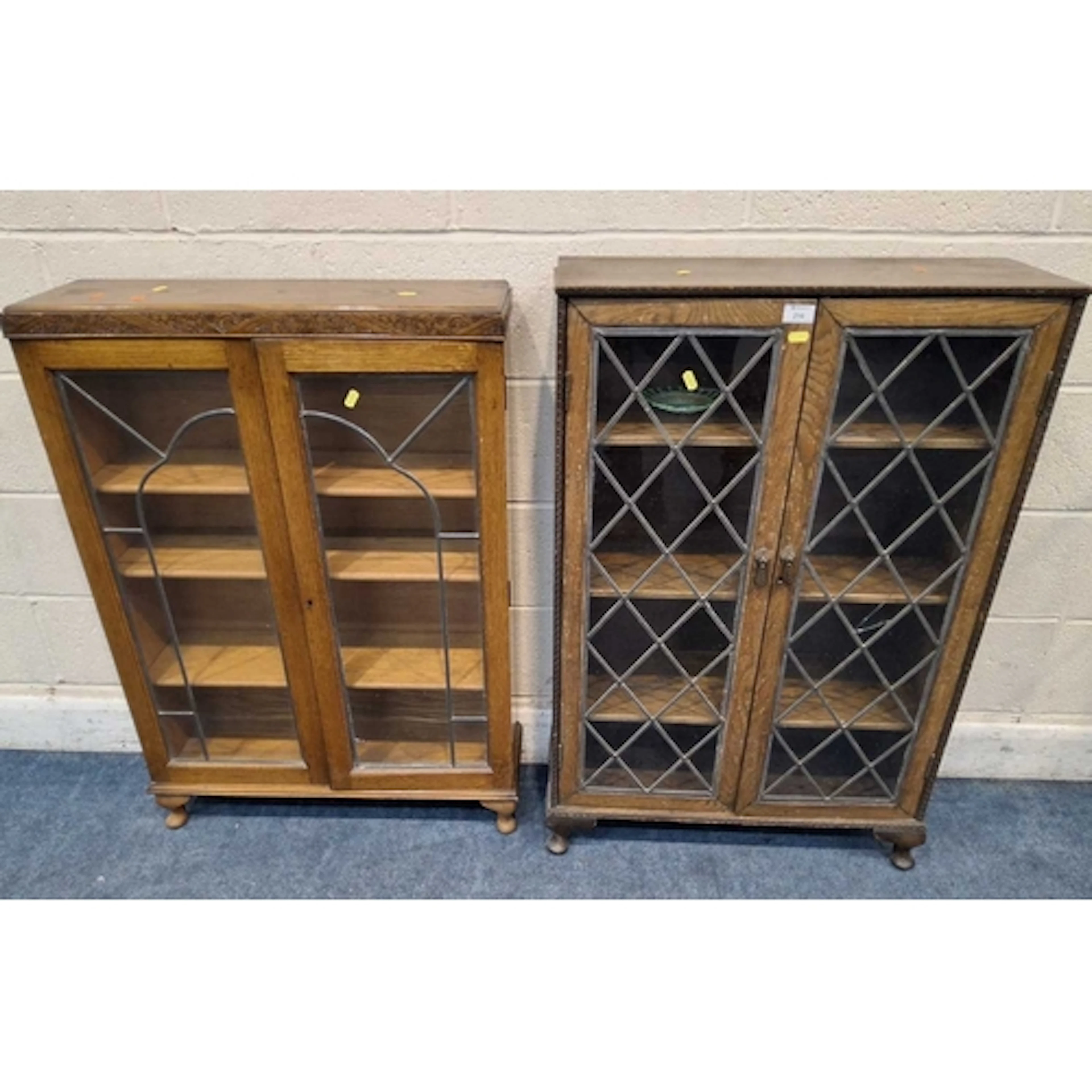 TWO 20TH CENTURY OAK BOOKCASES, both with double lead-glazed...