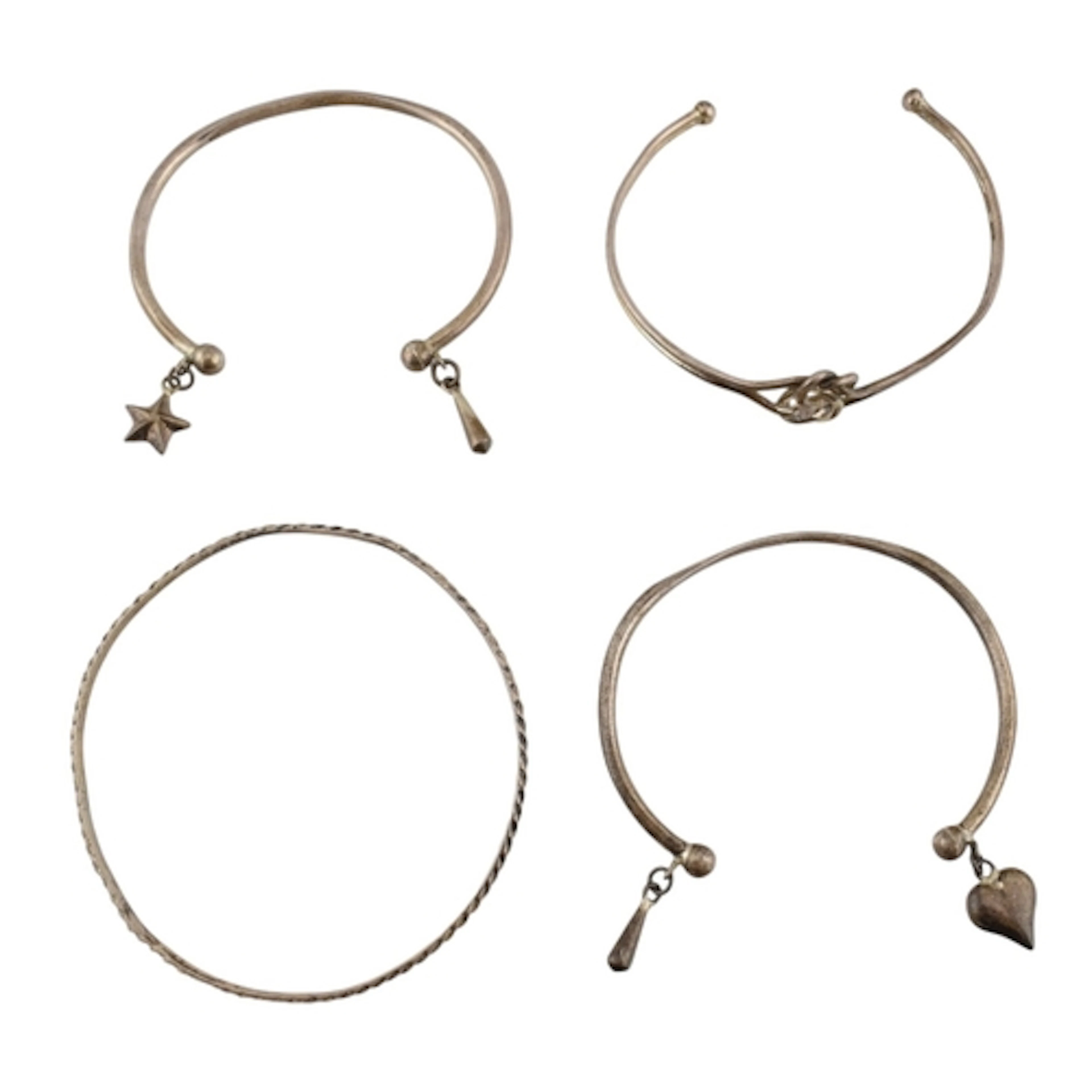 Collection of silver bangles and cuff bracelets. Four bracel...
