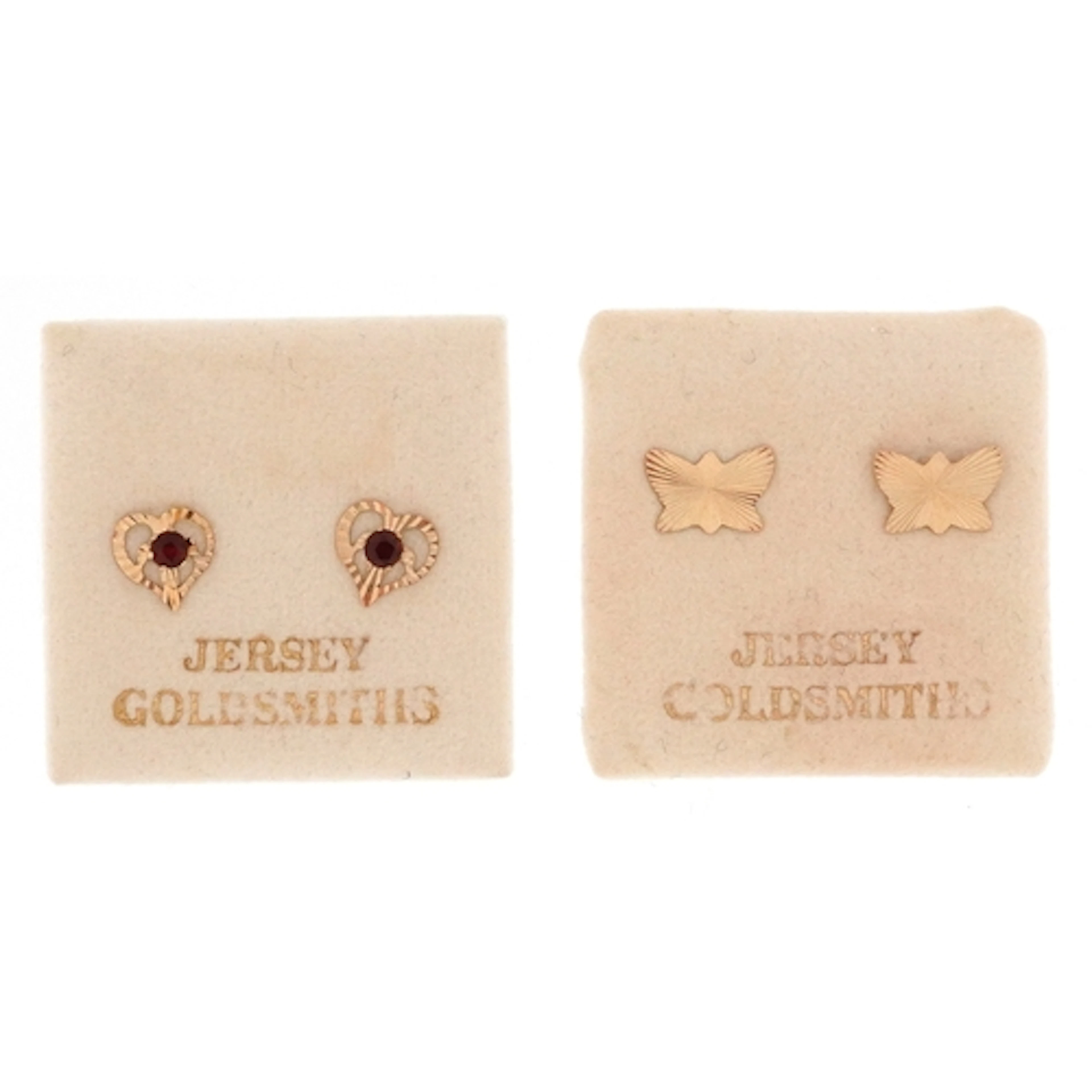 Two pairs of unmarked gold stud earrings, one set with garne...
