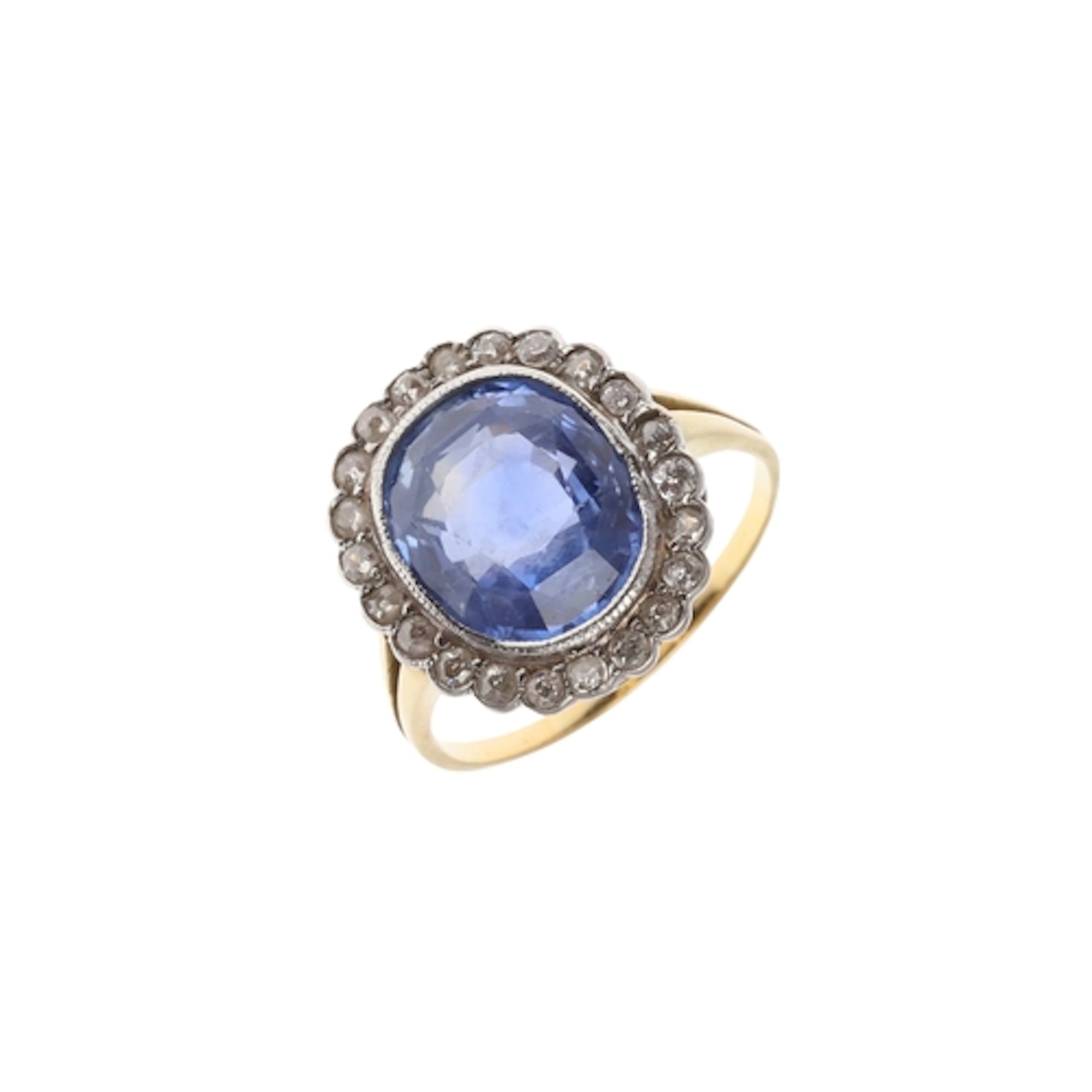 A SAPPHIRE AND DIAMOND CLUSTER RING. the cushion-shaped sapp...