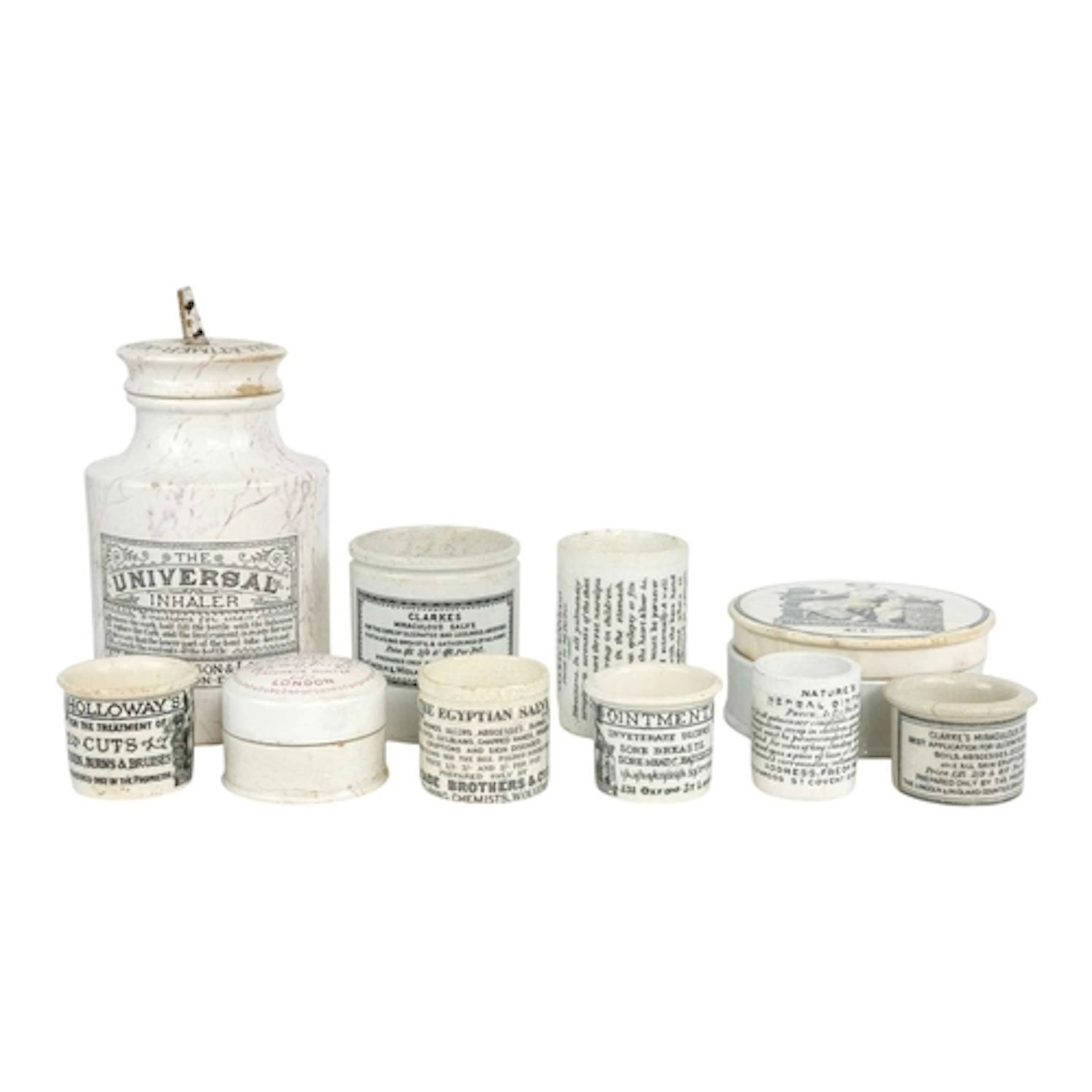 A collection of transfer printed ointment pots and jars. Lat...