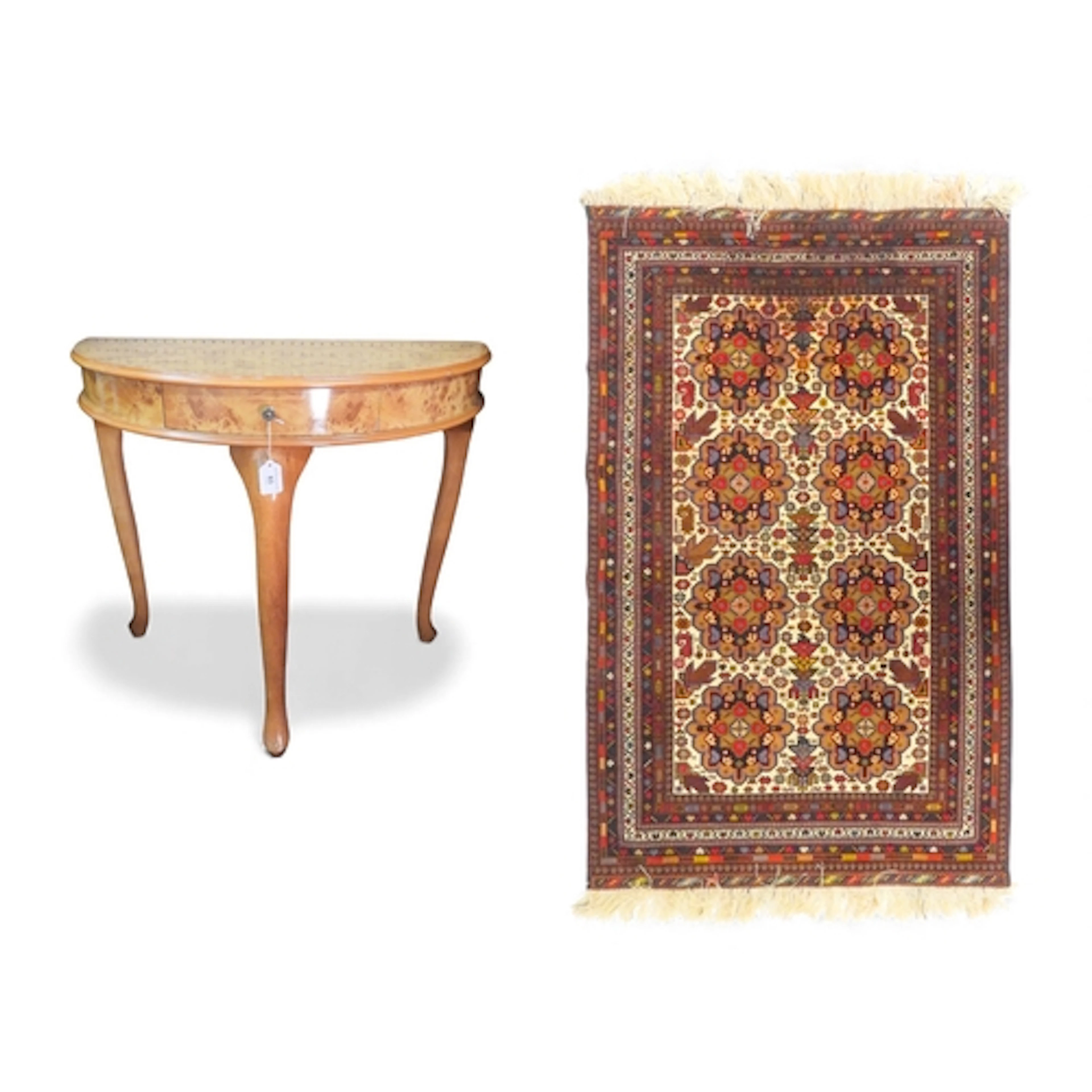 A lot comprising a white ground Turkman rug with eight multi...