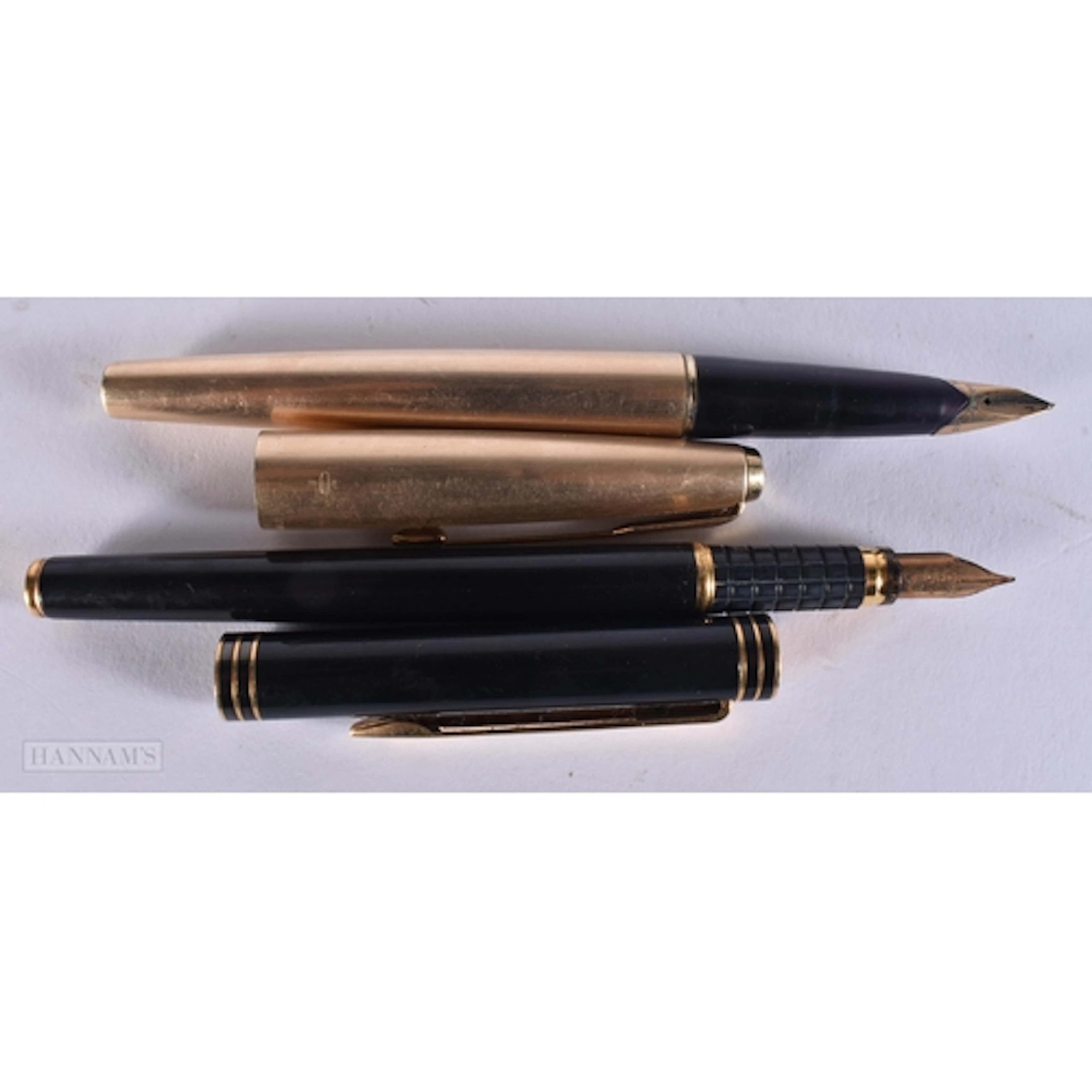 A 14CT GOLD NIBBED PARKER FOUNTAIN PEN together with an 18ct...