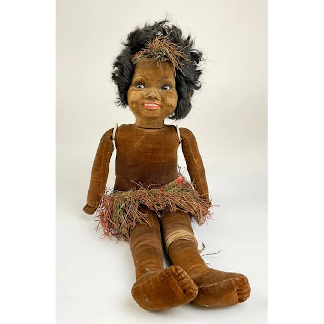A Norah Wellings South Sea Islander black doll, brown glass ...