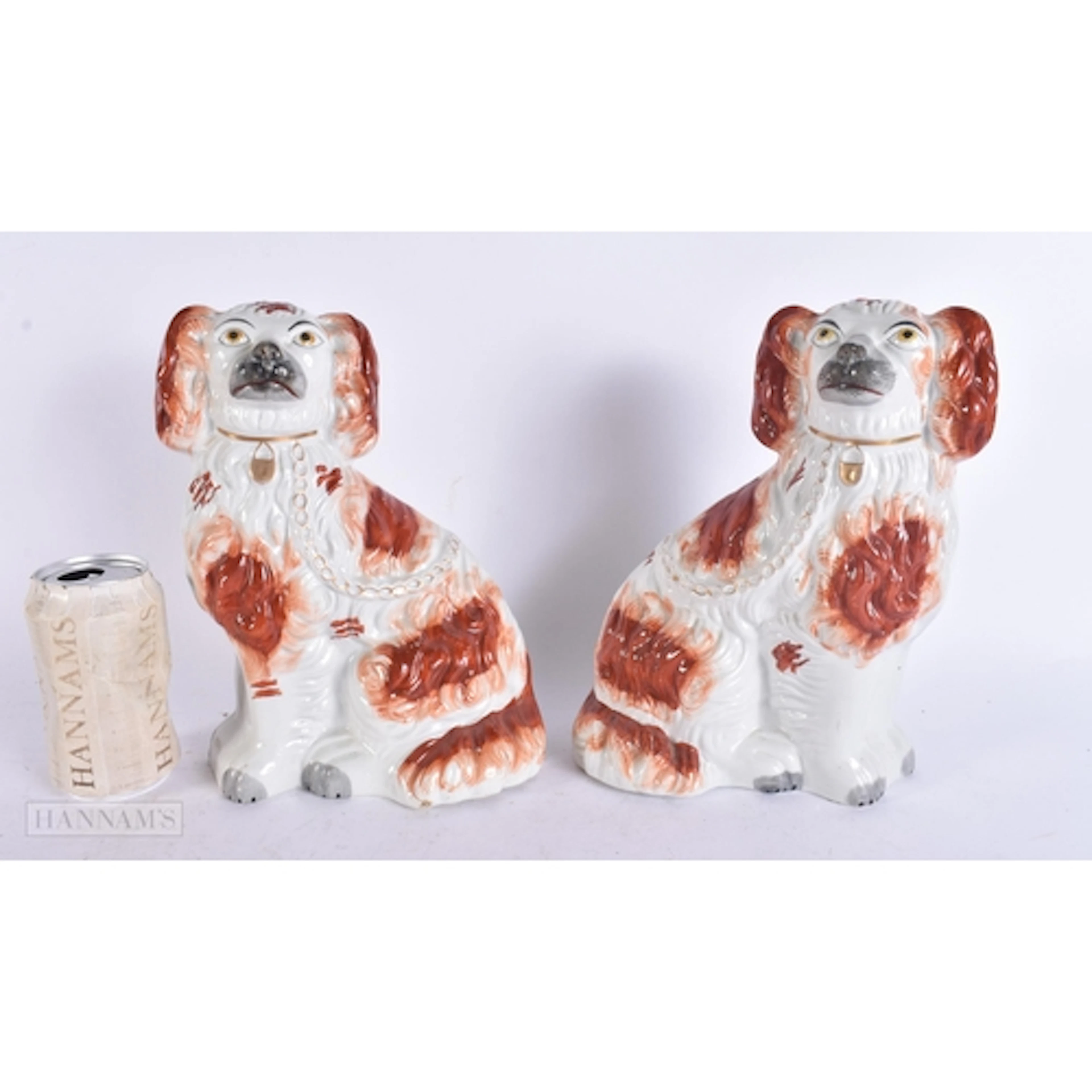 A PAIR OF VICTORIAN RED STAFFORDSHIRE DOGS. 25 cm x 14 cm.
