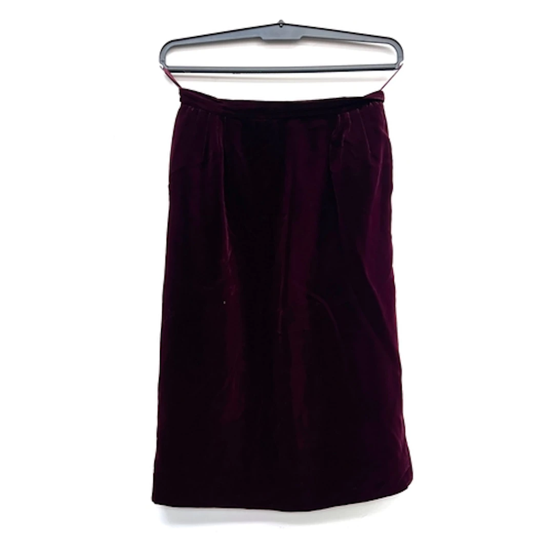 A burgundy velvet skirt, size 12; together with vintage petr...
