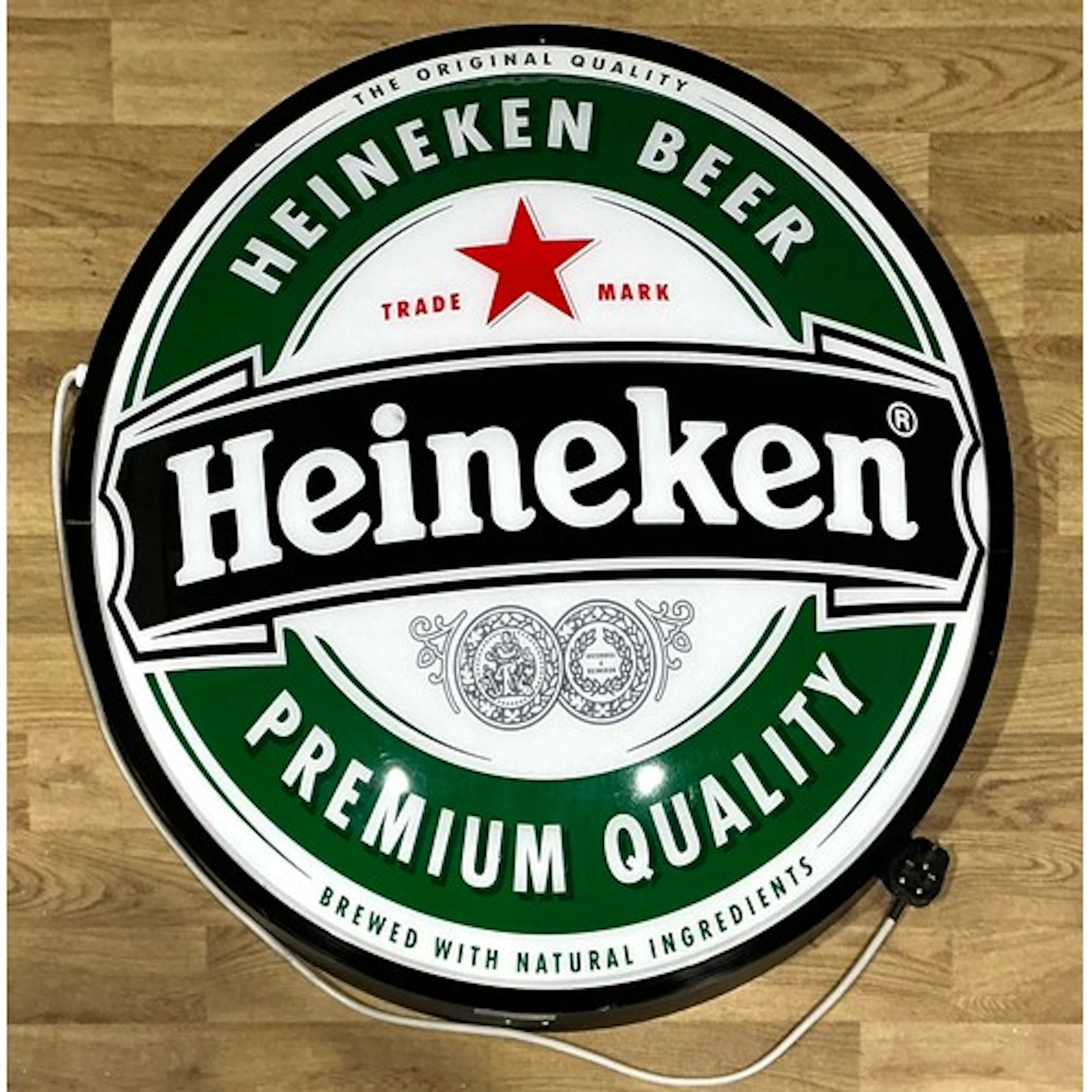 Advertising - a large illuminated convex circular wall sign,...