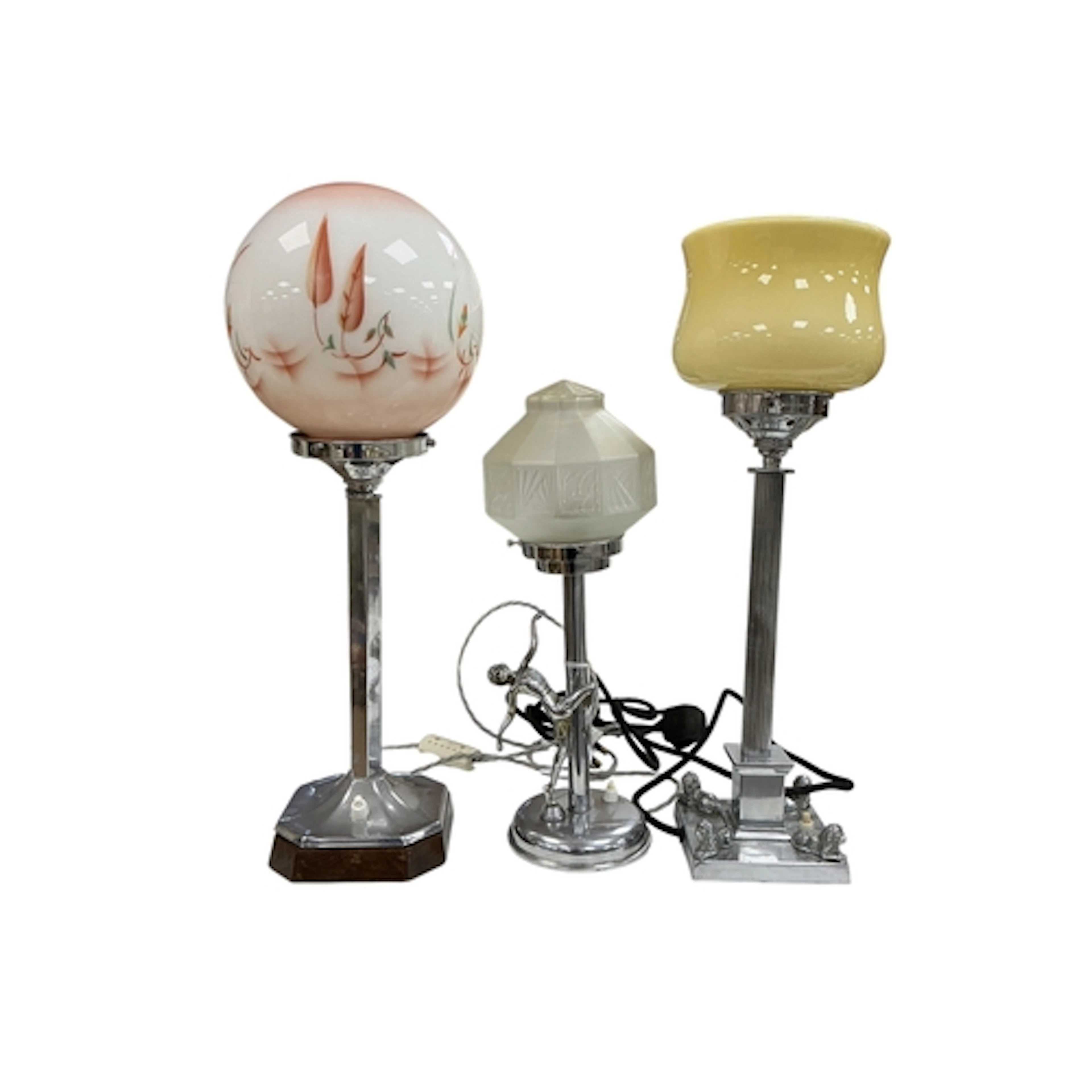 A group of three Art Deco-style chrome table lamps with colo...
