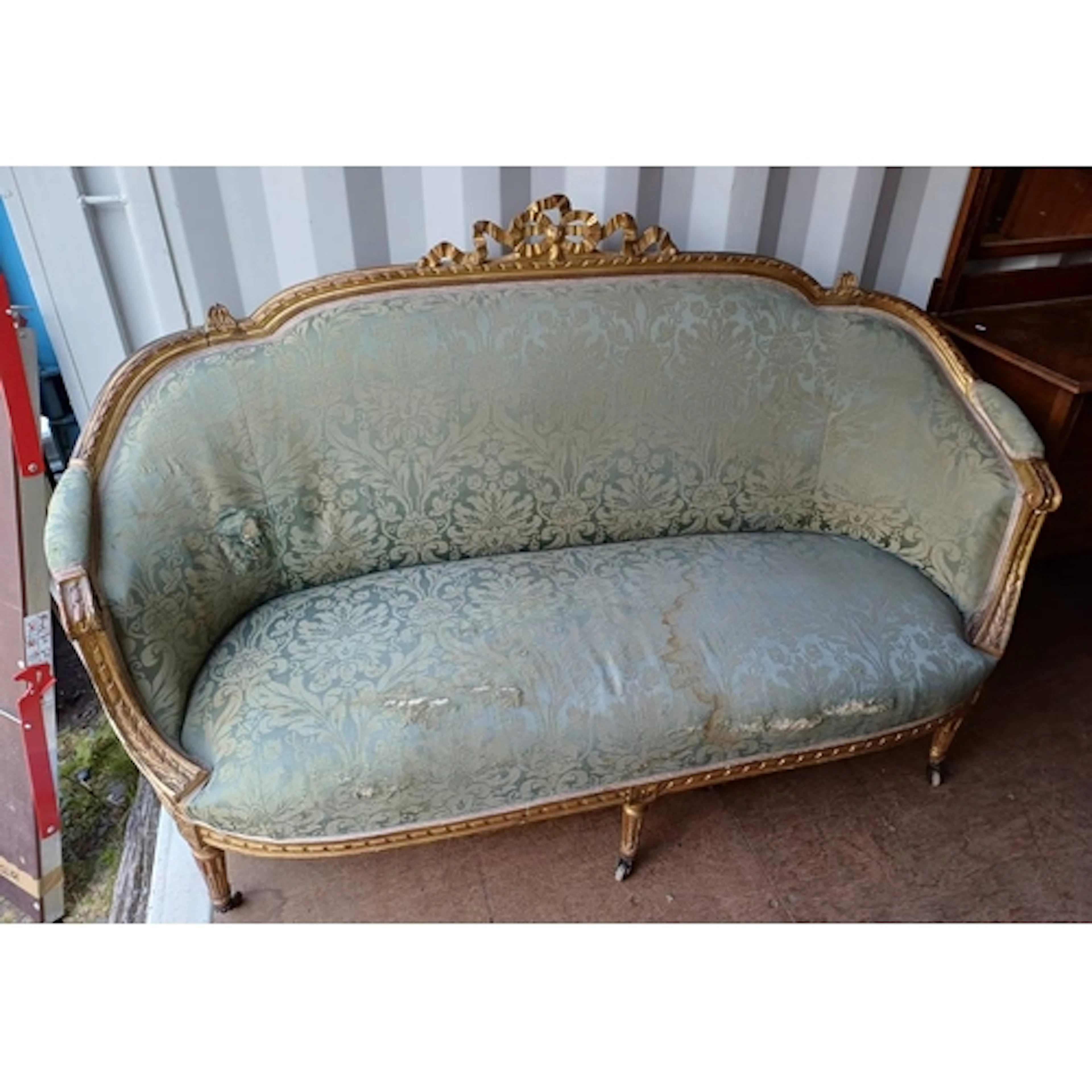 CARVED GILT FRAMED PARLOUR SETTEE ON REEDED SUPPORTS IN THE ...