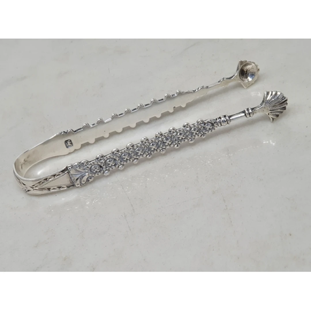 A pair of Georgian Chippendale design Sugar Tongs with brigh...