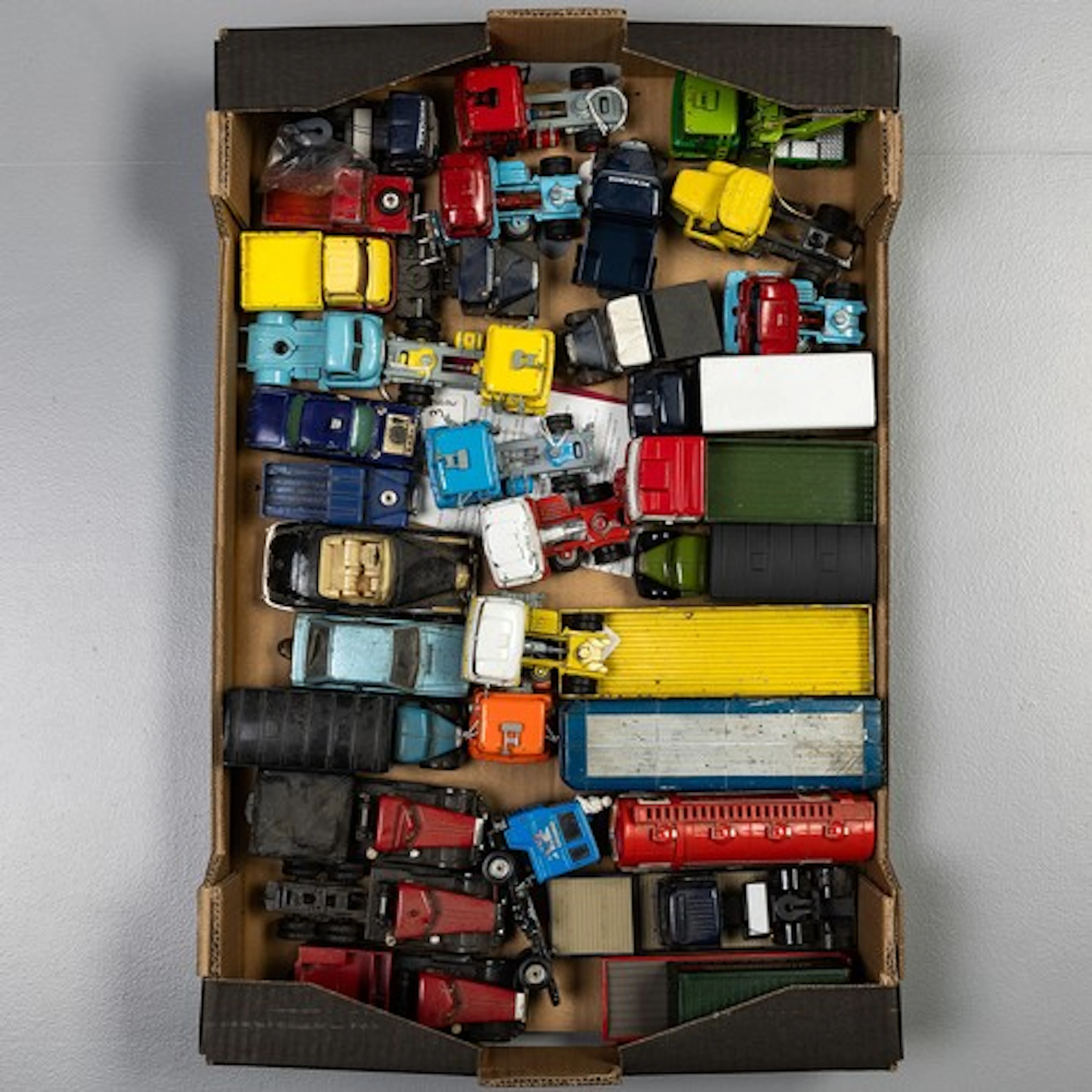 Fruit tray containing a selection of Corgi commercial vehicl...