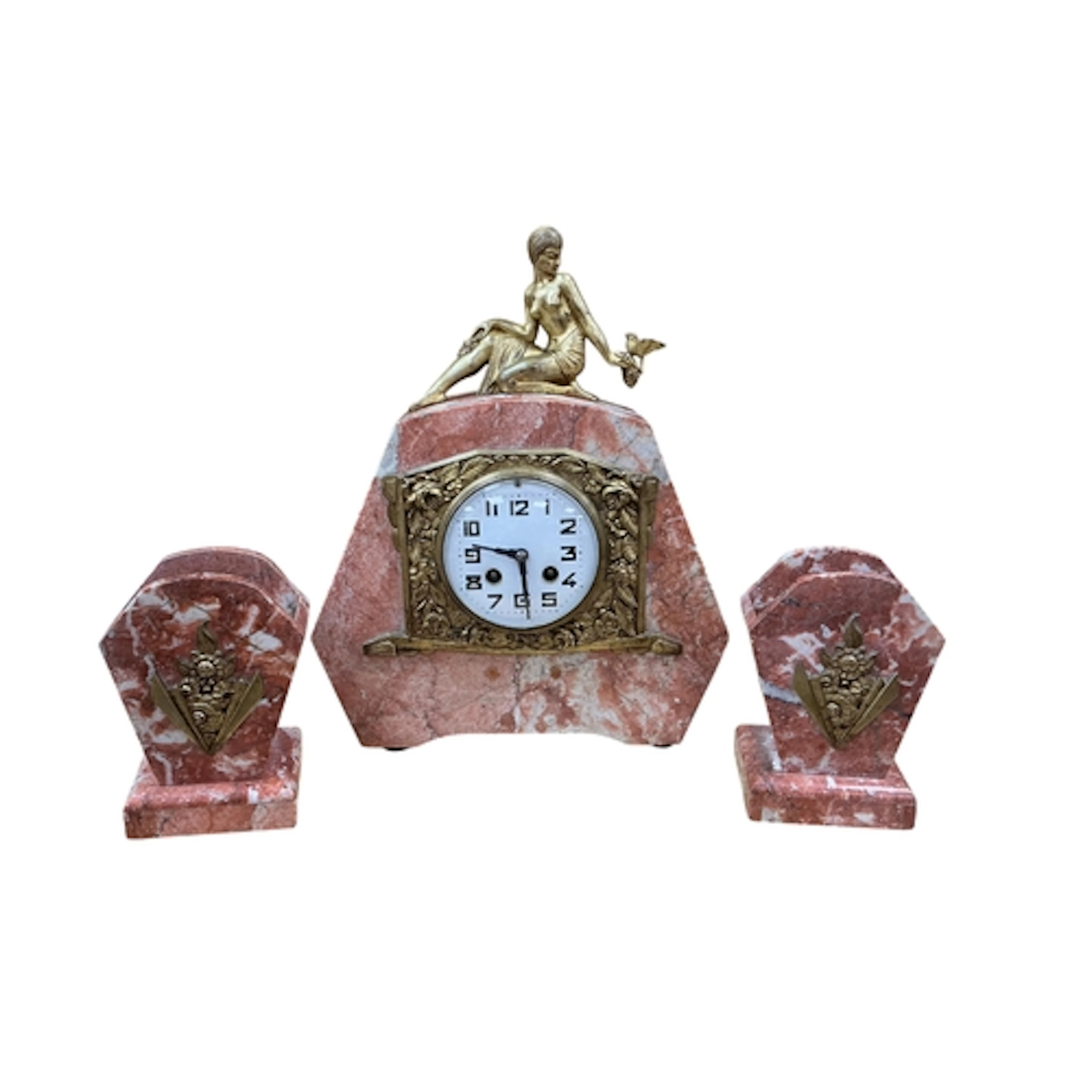 A French Art Deco rouge marble clock garniture surmounted wi...
