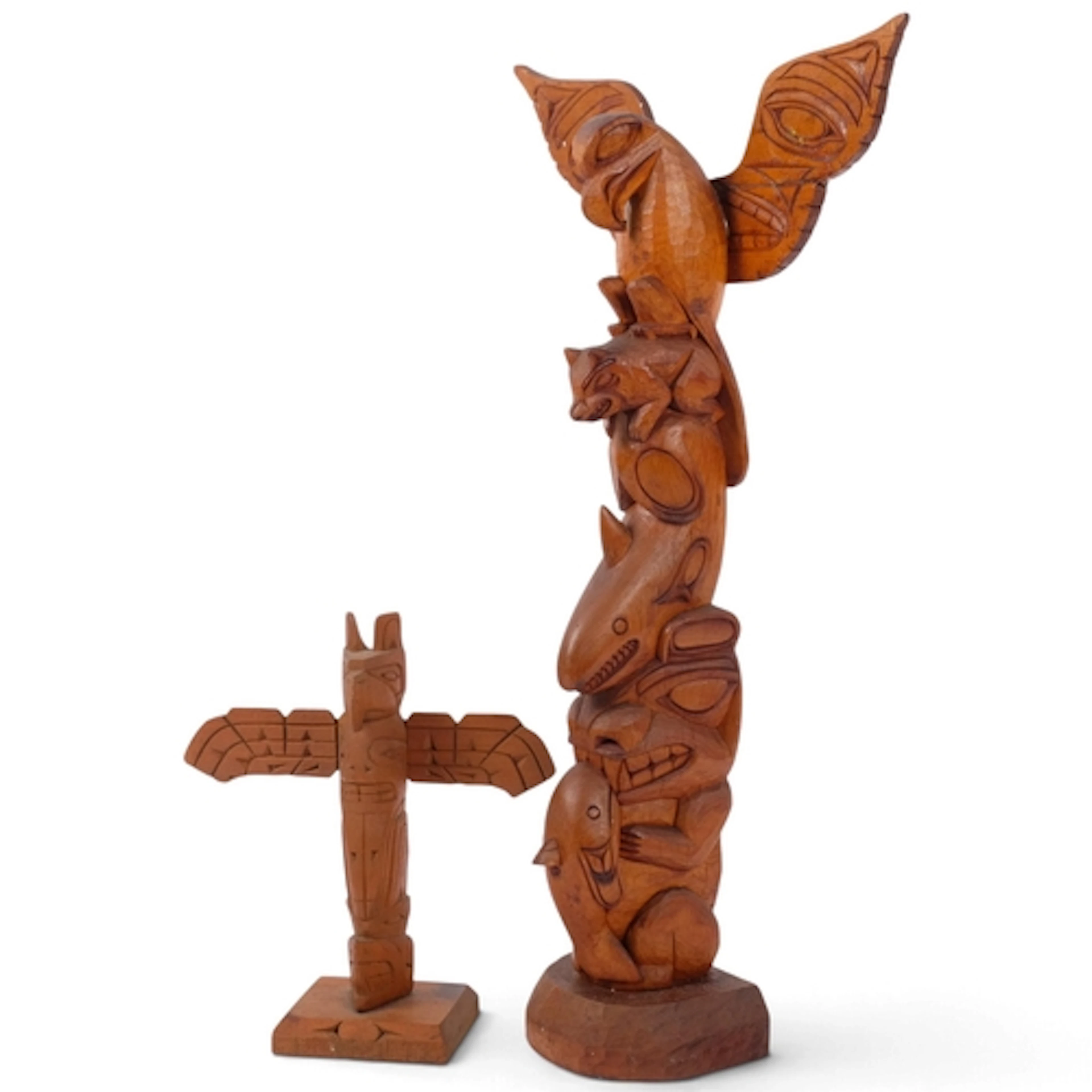 A North West Coast carved wood totem pole, H42cm, and a smal...