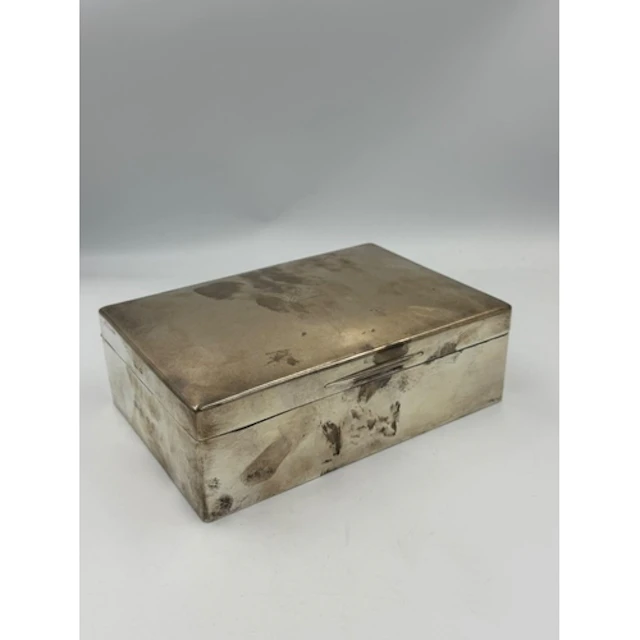 A large silver cigarette box by Padgett & Braham Ltd of ...