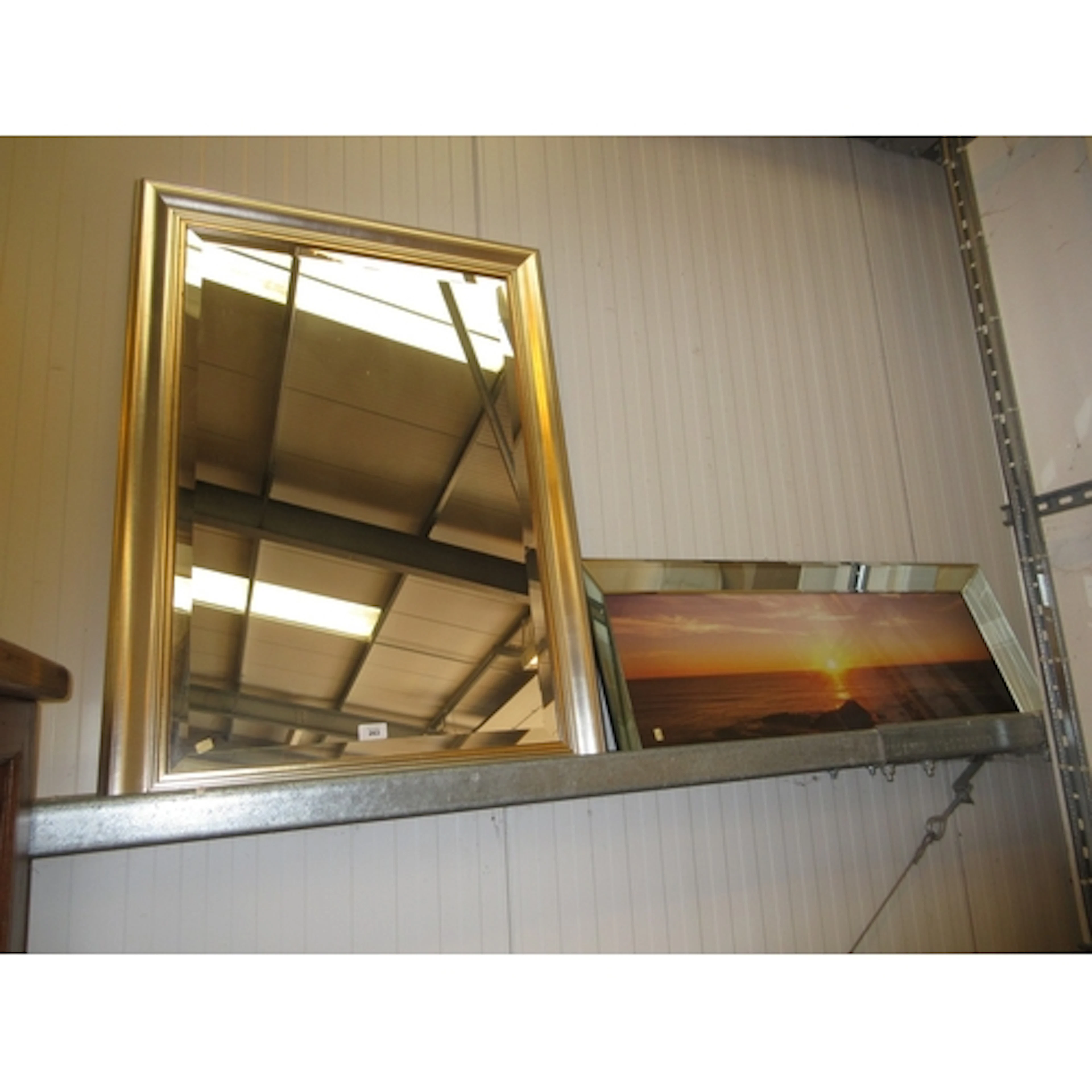 Framed Wall Mirror and a Sunset Picture
