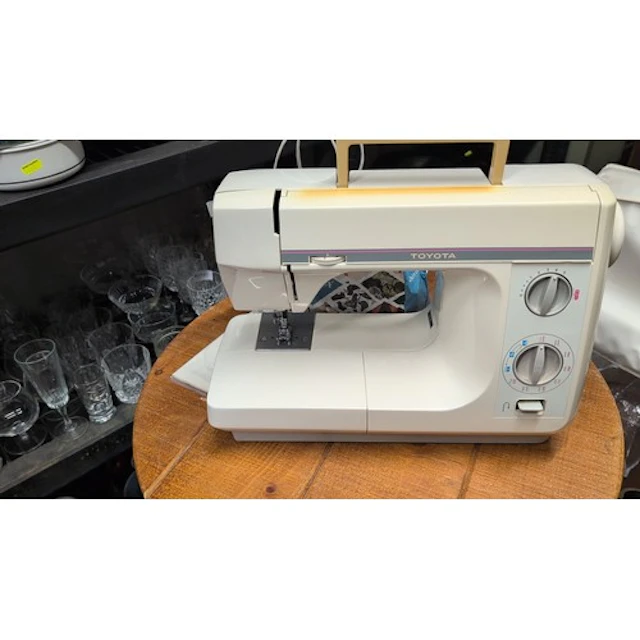Toyota Model 4081 electric sewing machine with free-arm bed,...