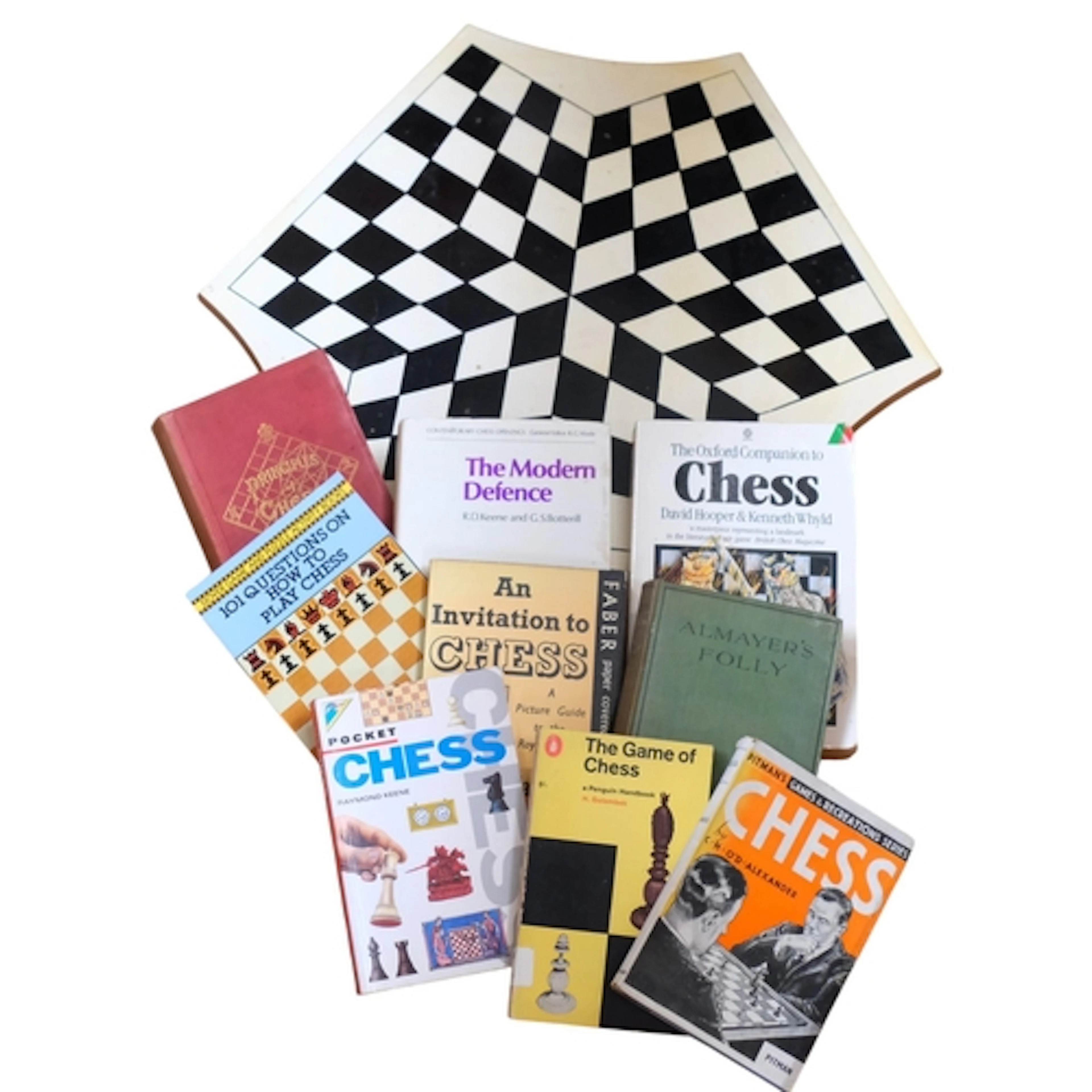 A games board for 3 people, and books on chess