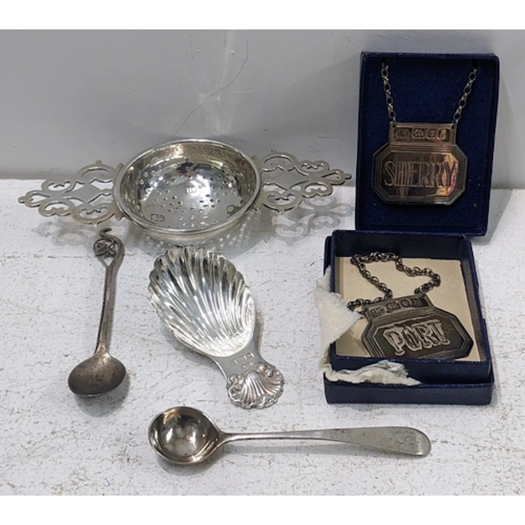 Mixed silver to include a tea strainer, caddy spoon, two win...