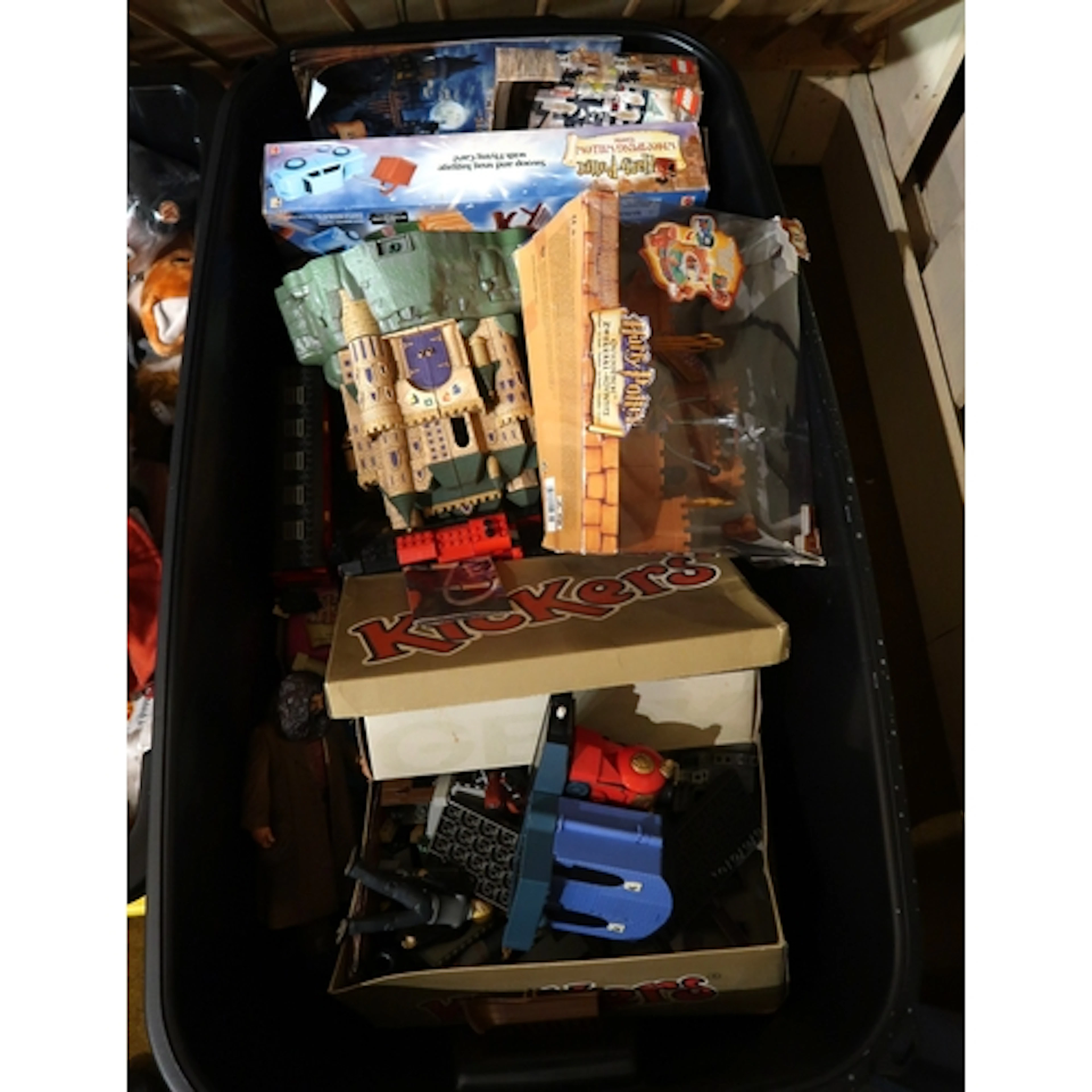 Box containing a large quantity of Harry Potter related toys