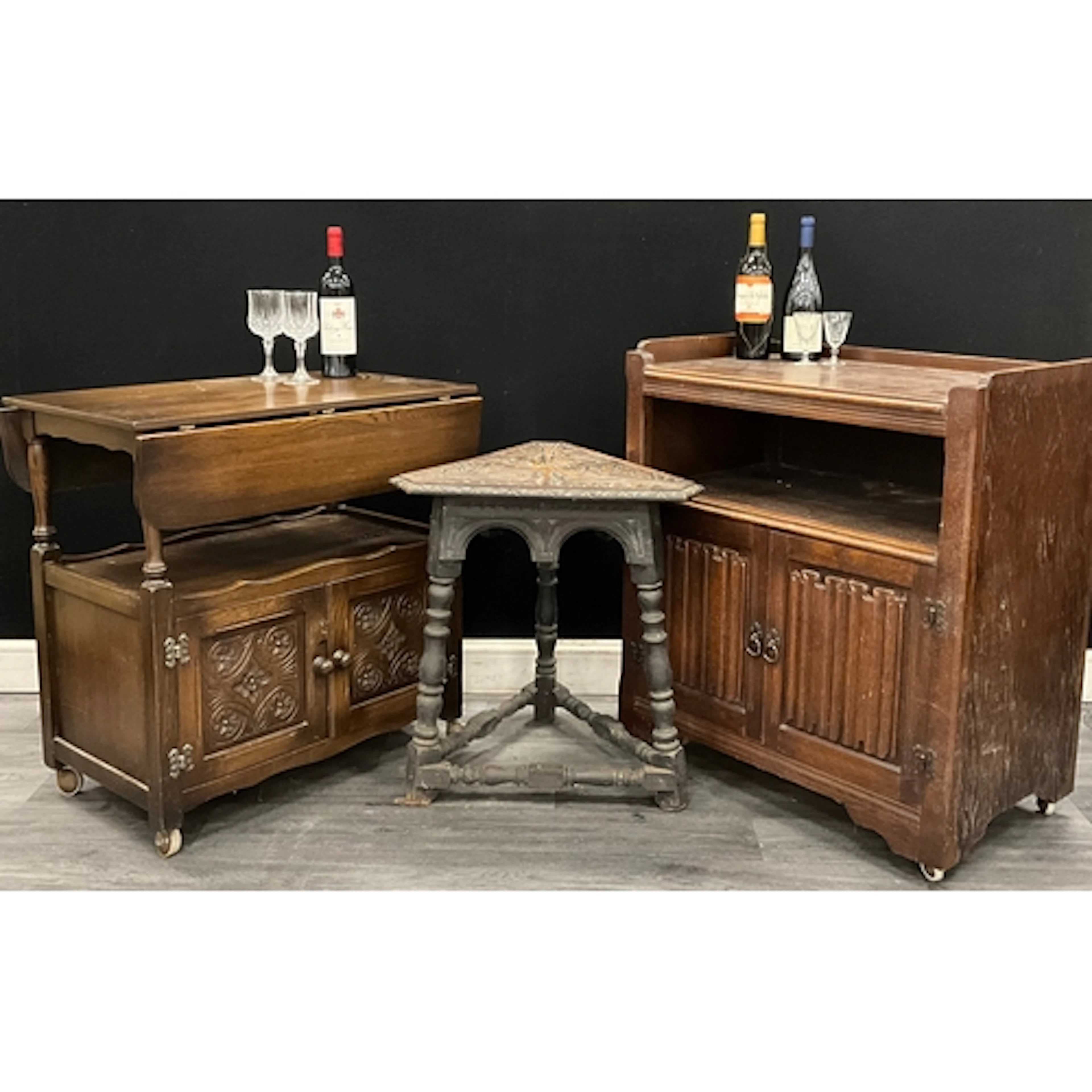 A mid century dark Oak drop leaf drinks trolley with floral ...