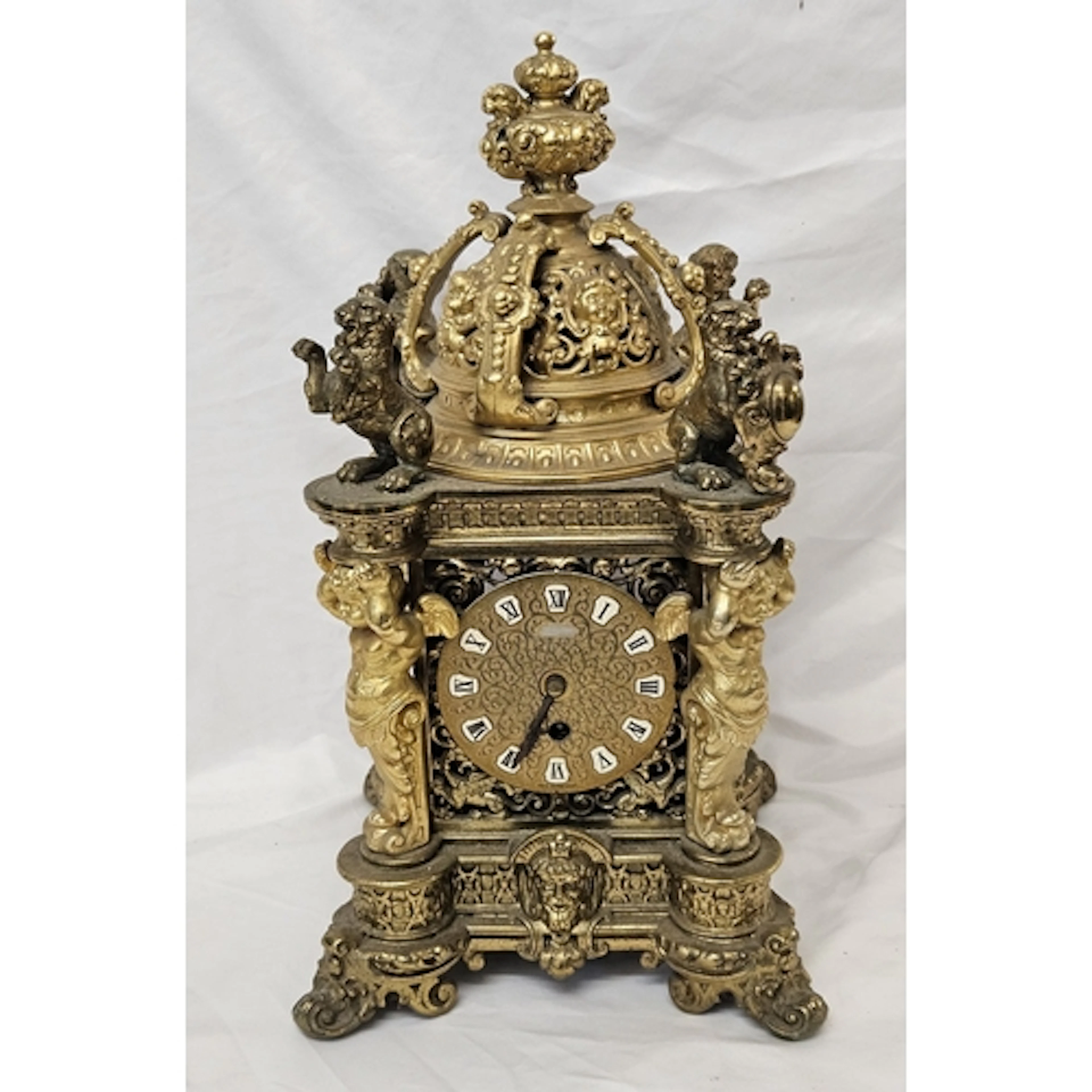 Heavy Cast Brass Mantel Clock with 4 winged putti quadrant s...